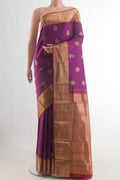 Pure Silk Purple Kanjivaram Saree with Zari Butta on the body and Zari Border.  displayed on a mannequin