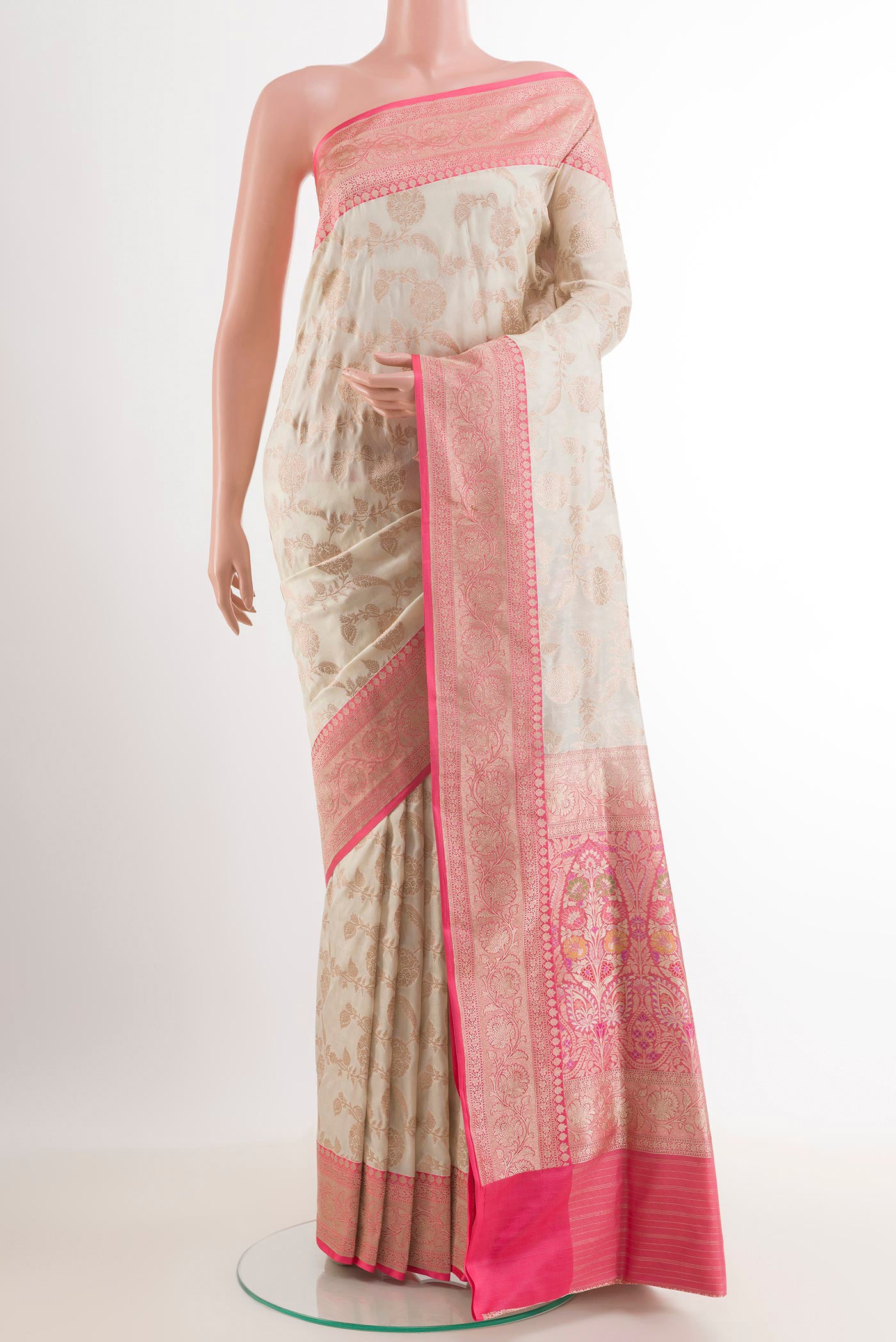Off White Banarasi Silk Saree with Plain Body and Zari Border.  displayed on a mannequin
