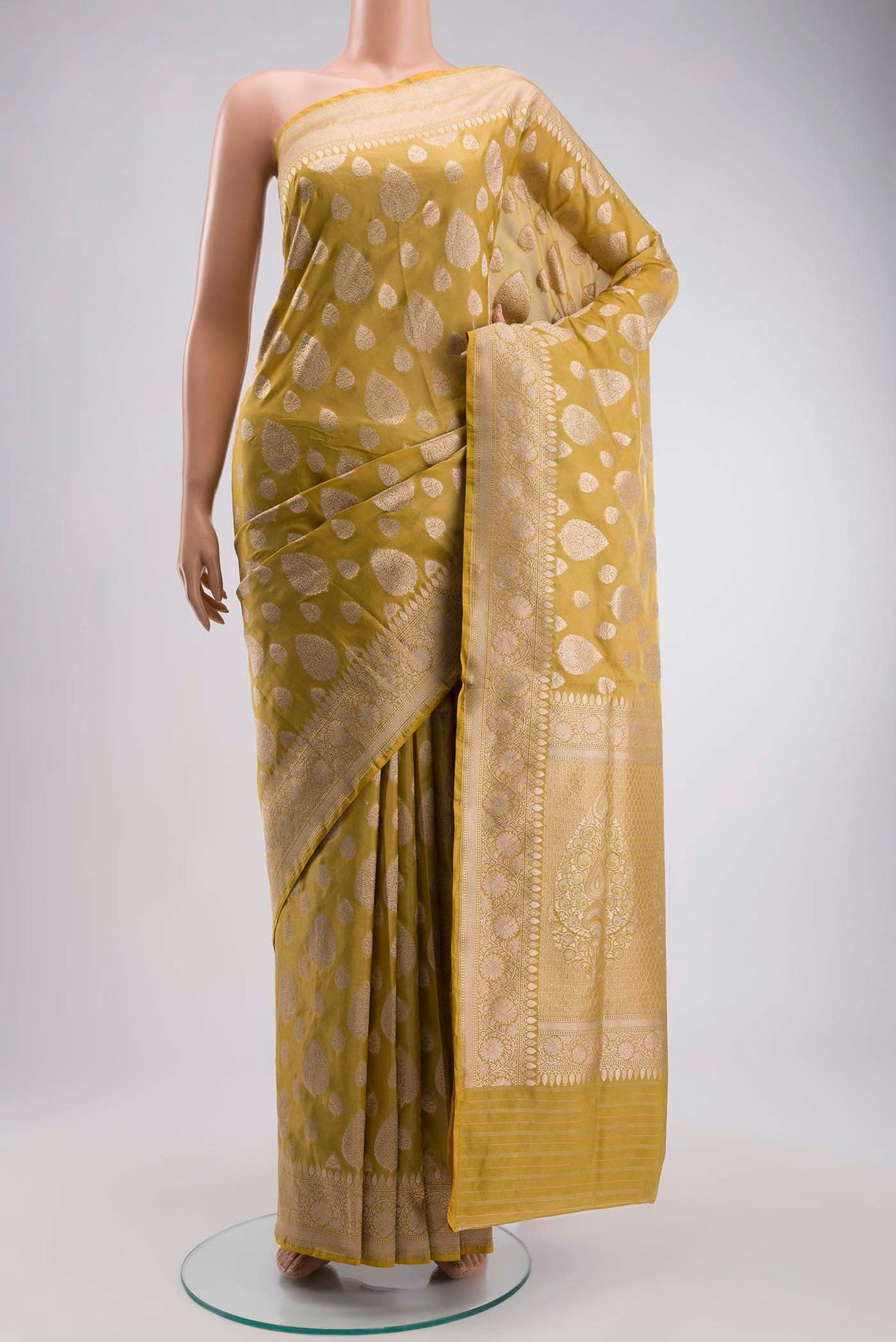 Yellow Banarasi Silk Saree with Zari Butta on the body and Zari Border displayed on a mannequin
