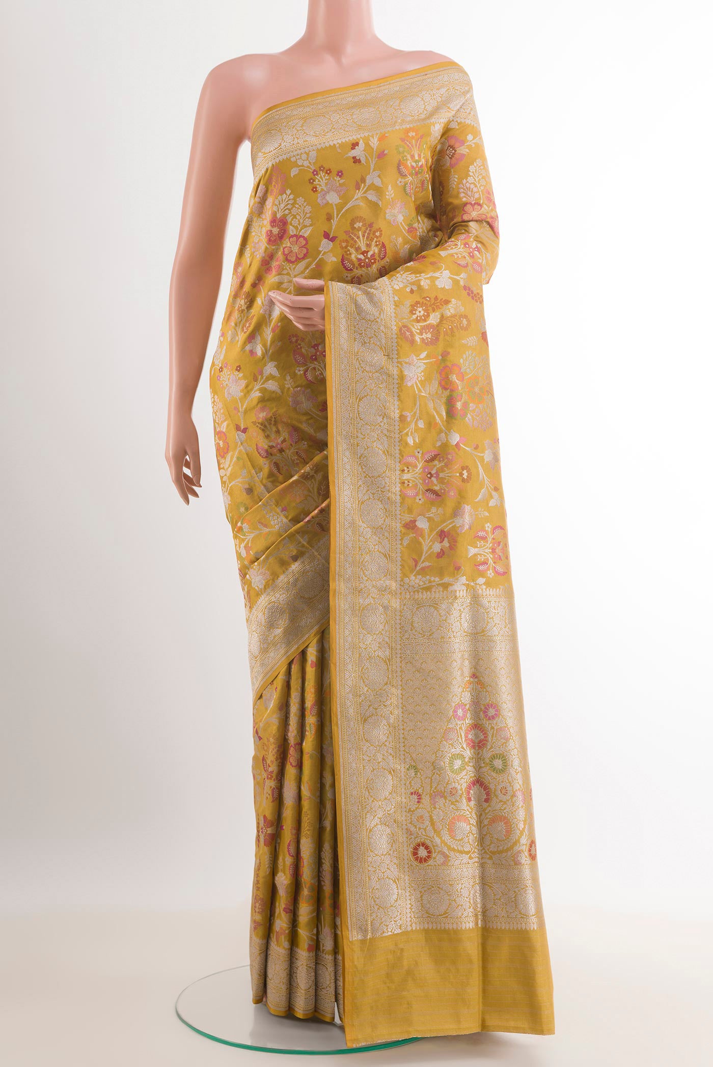 Yellow Banarasi Tissue Silk Saree with Zari Butta on the body and Zari Border.  displayed on a mannequin
