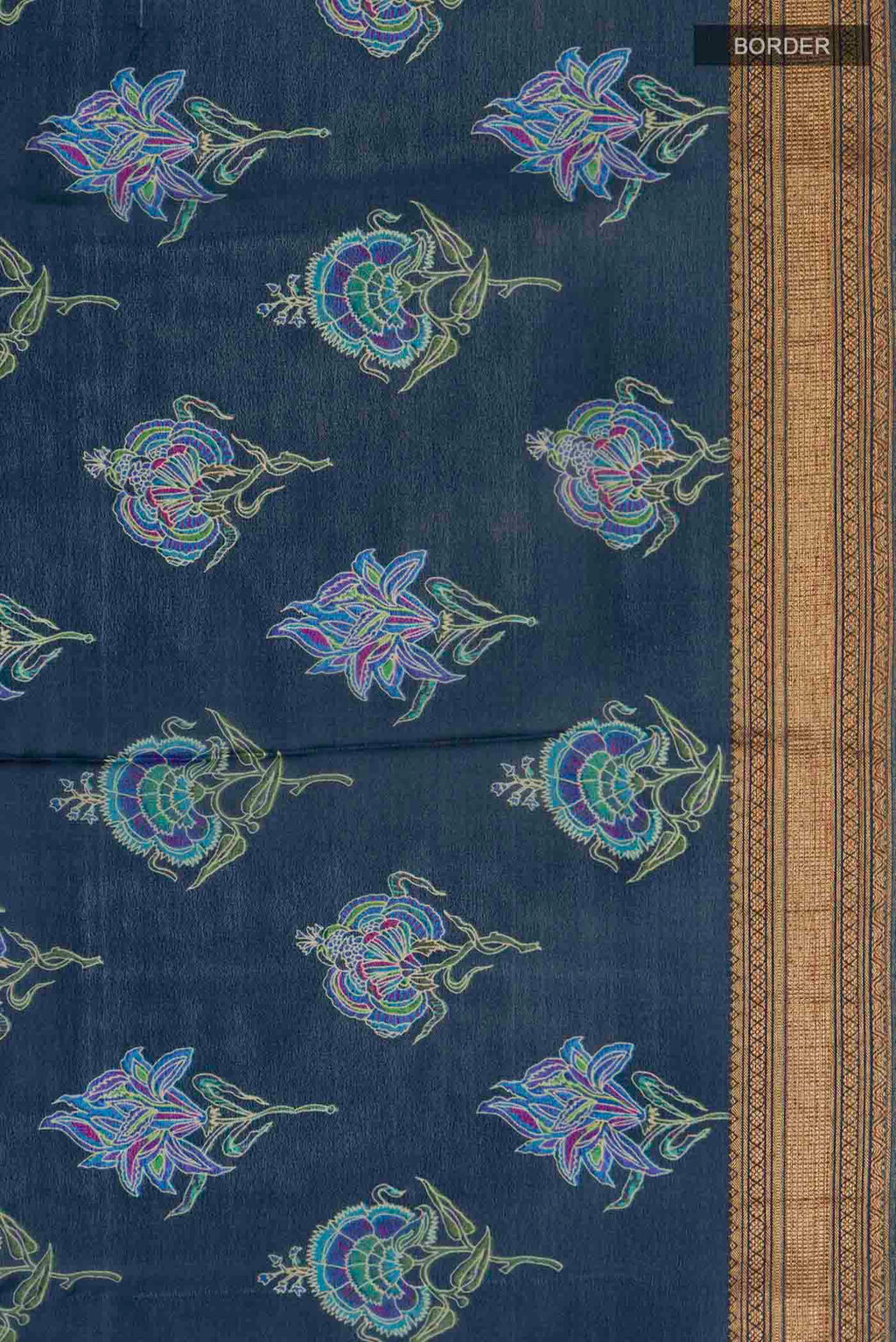 Border image of Blue Crepe Saree with Printed design on the body and Zari Border