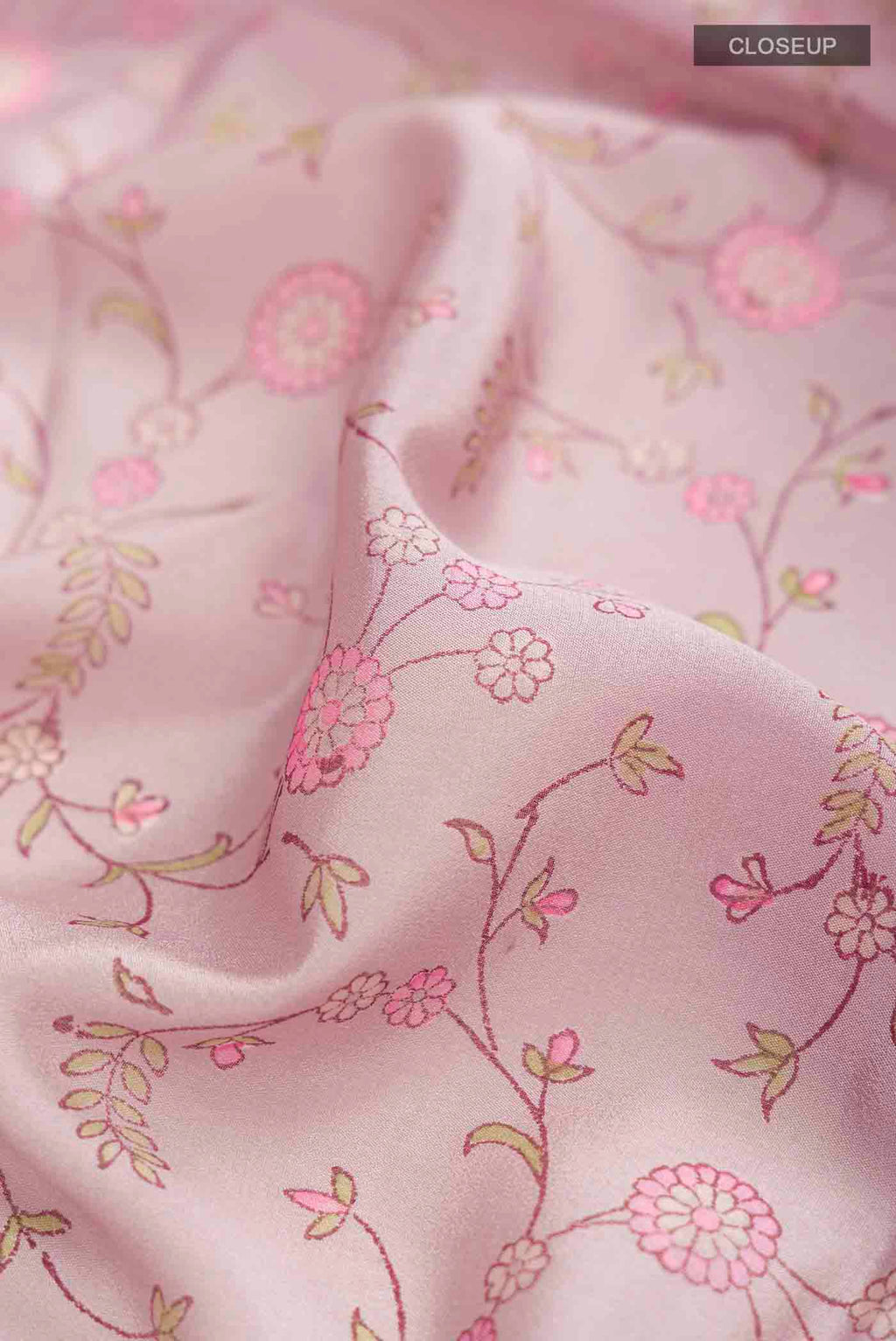 Close up of Lavender Mysore Crepe Saree with Printed design on the body and Zari Border displaying folds