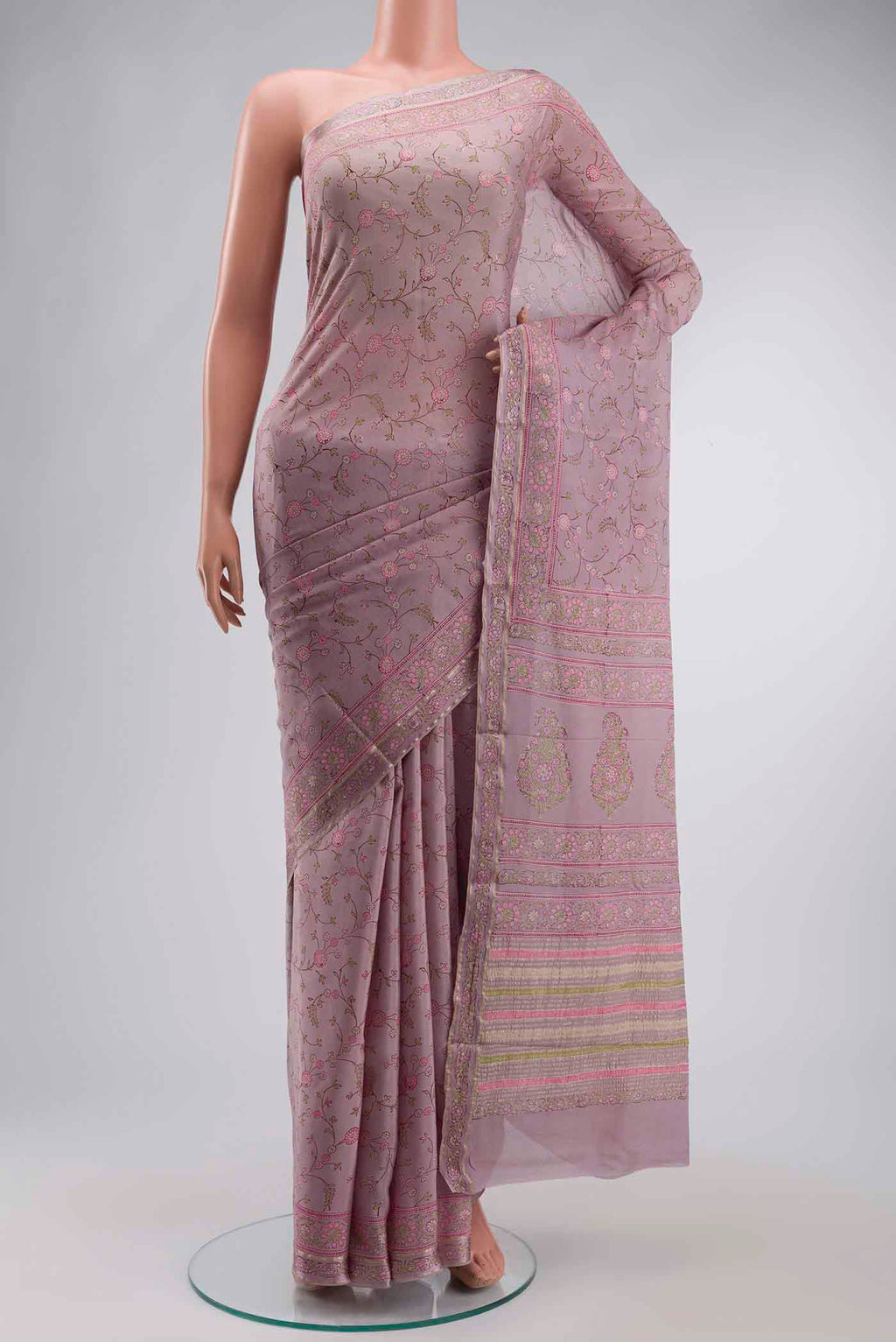 Lavender Mysore Crepe Saree with Printed design on the body and Zari Border displayed on a mannequin