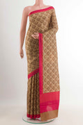 Beige Printed Silk Saree with Printed design on the body and Plain Border.  displayed on a mannequin