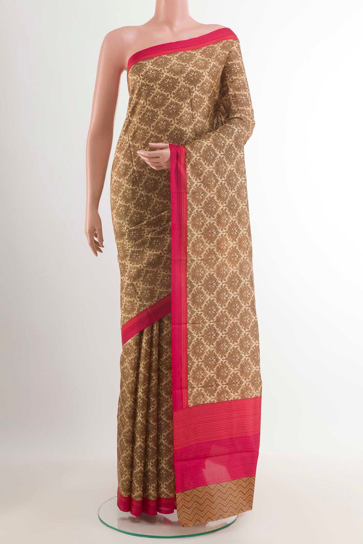 Beige Printed Silk Saree with Printed design on the body and Plain Border.  displayed on a mannequin