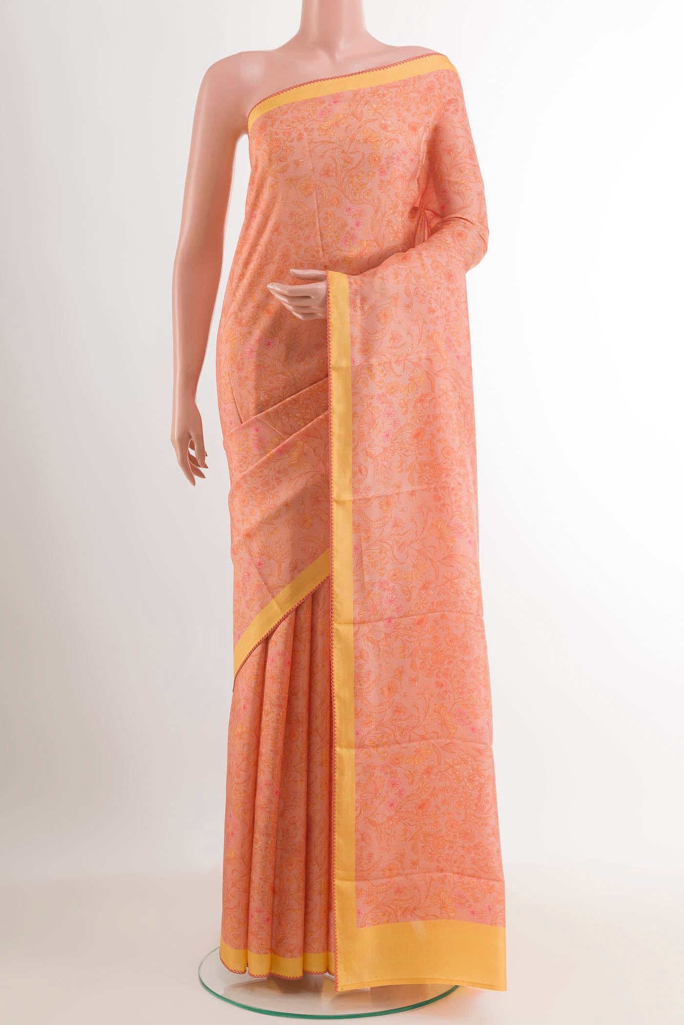 Pink Printed Silk Saree with Printed design on the body and Plain Border.  displayed on a mannequin