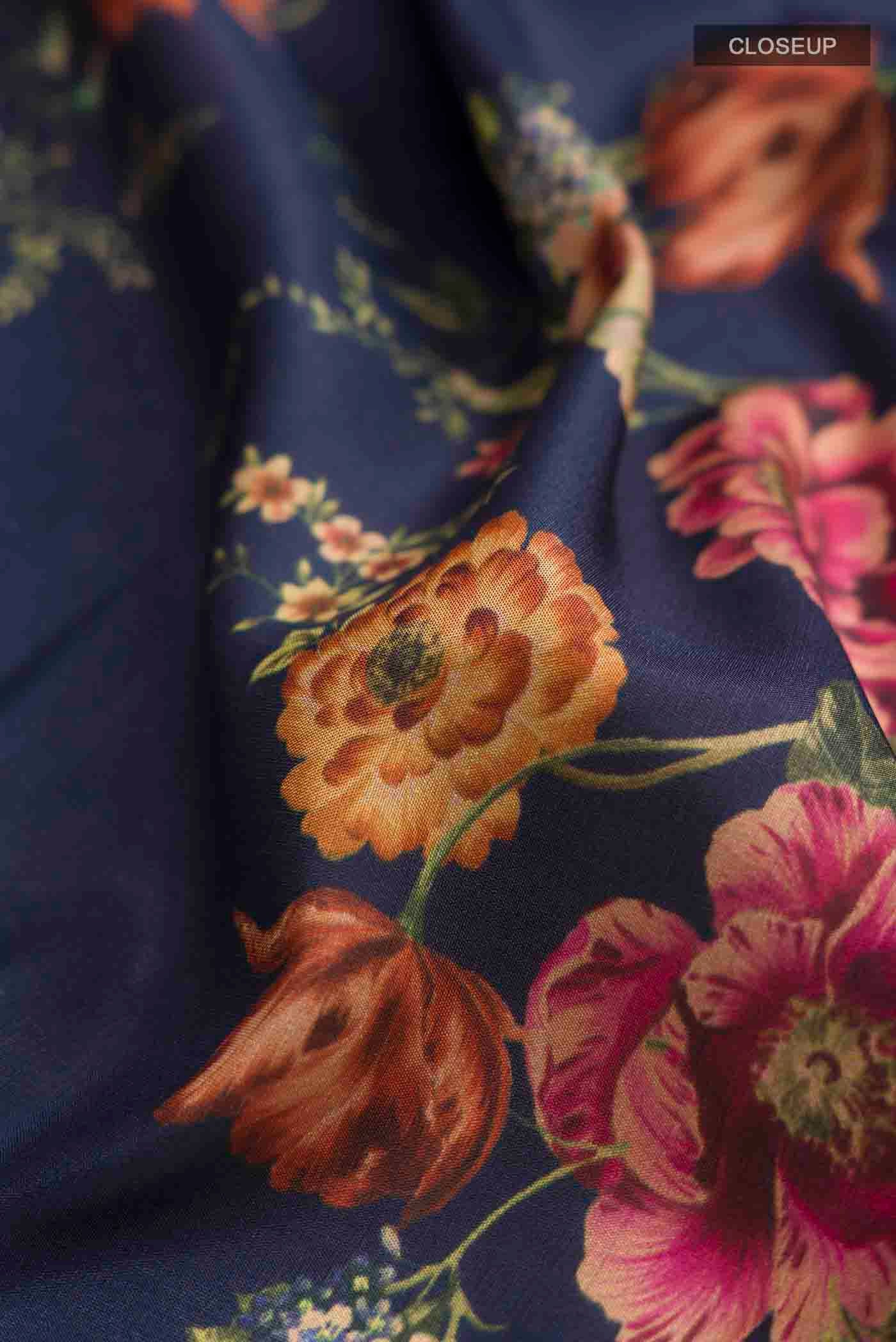 Close up of Navy Blue Printed Silk Saree with Printed design on the body and Zari Border displaying folds
