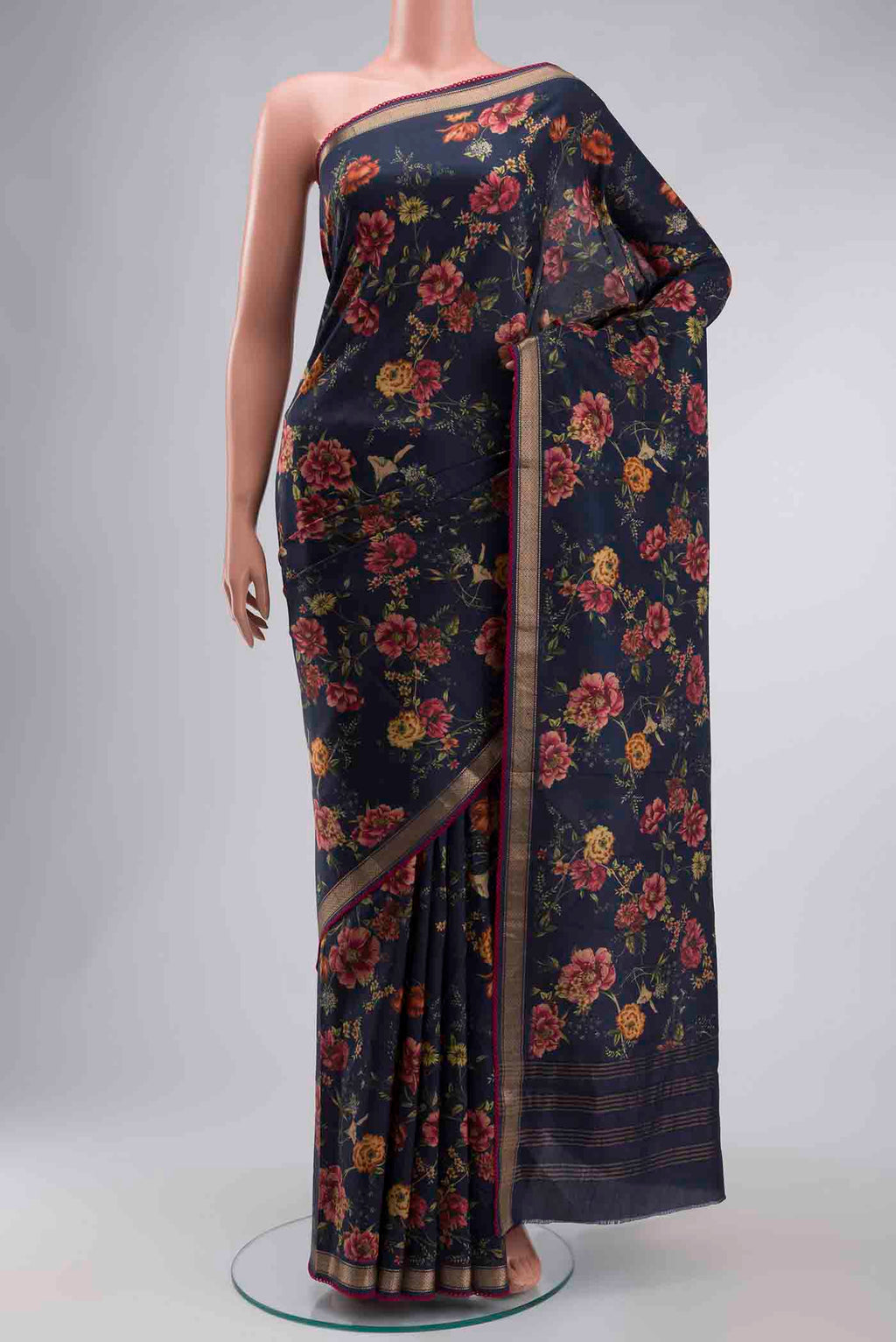 Navy Blue Printed Silk Saree with Printed design on the body and Zari Border displayed on a mannequin