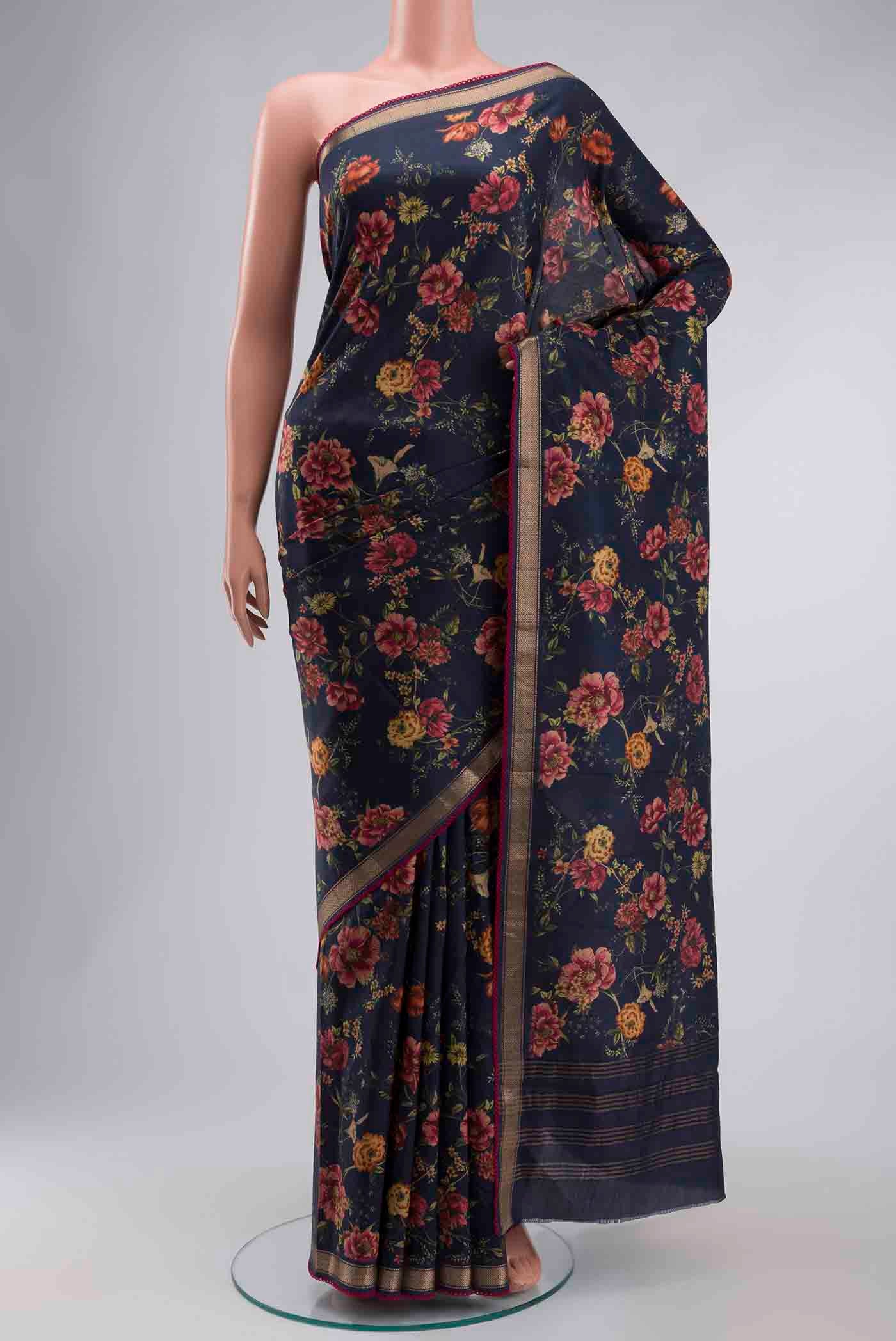 Navy Blue Printed Silk Saree with Printed design on the body and Zari Border displayed on a mannequin