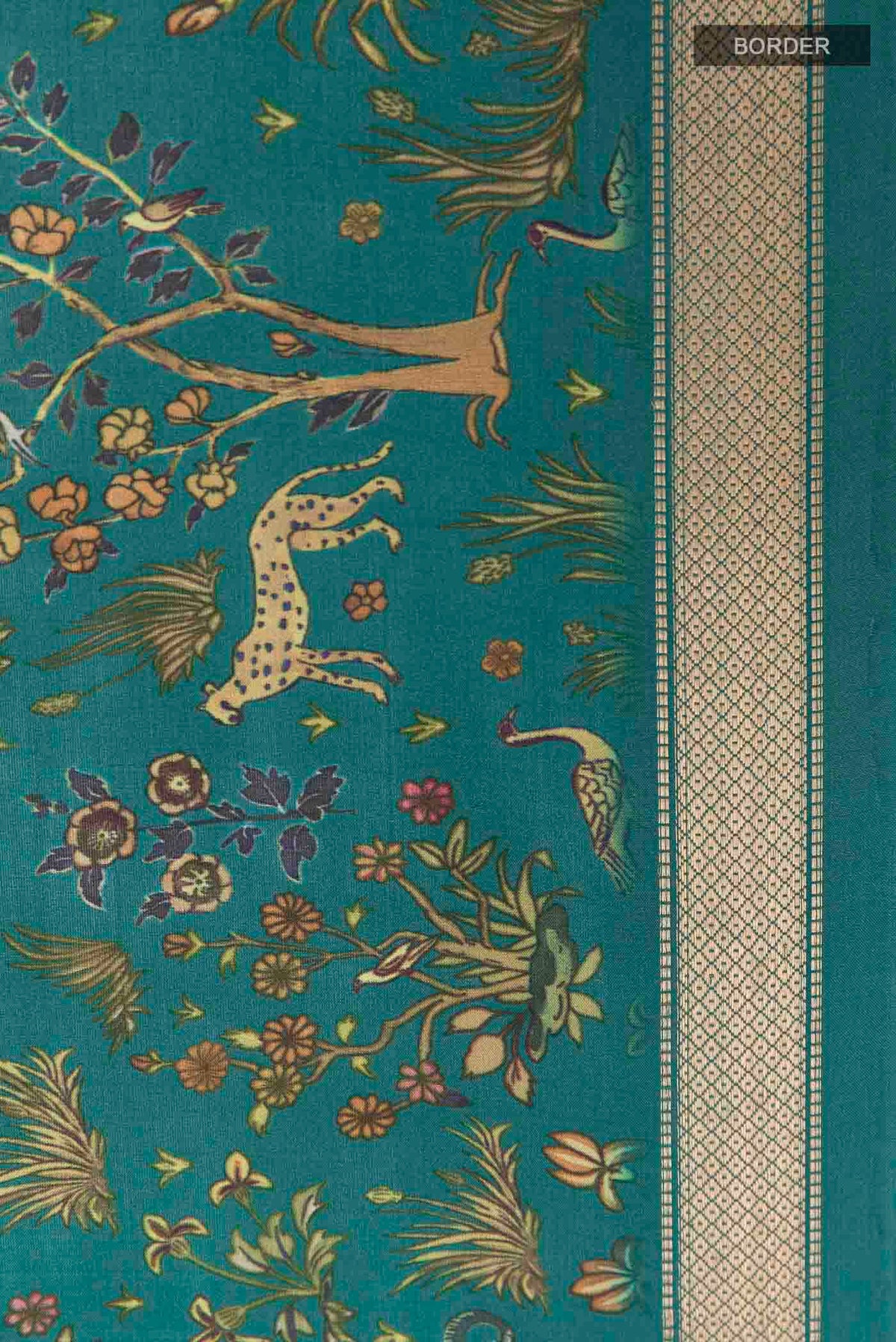 Border image of Green Printed Silk Saree with Printed design on the body and Zari Border