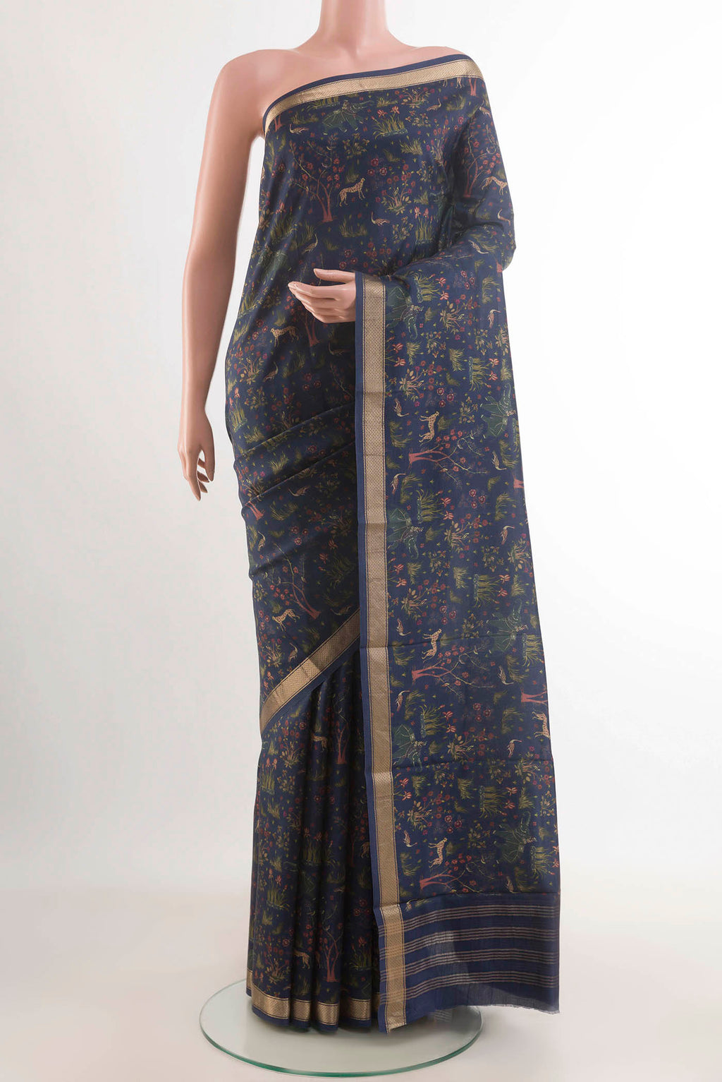 Blue Printed Silk Saree with Printed design on the body and Zari Border displayed on a mannequin
