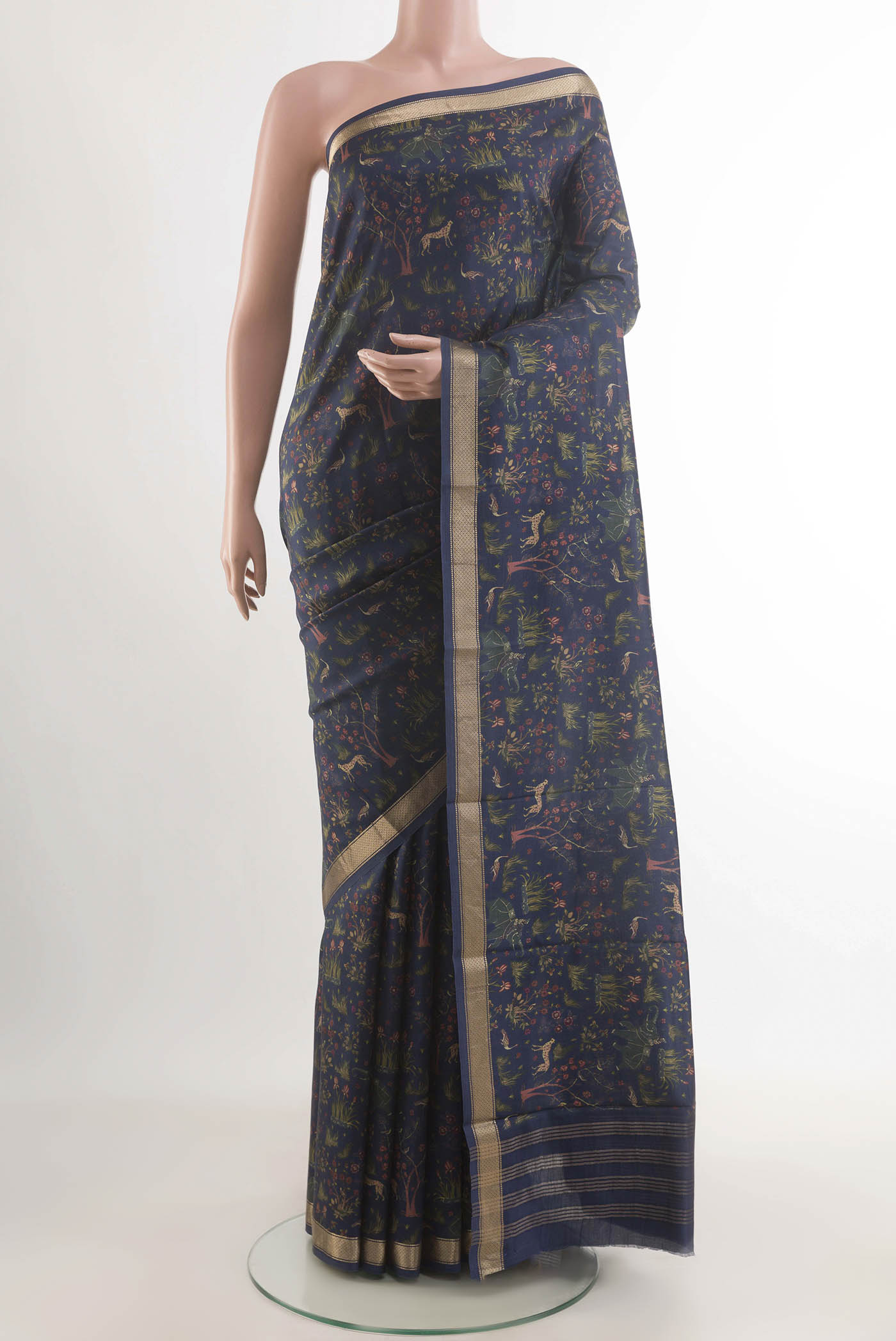 Blue Printed Silk Saree with Printed design on the body and Zari Border displayed on a mannequin