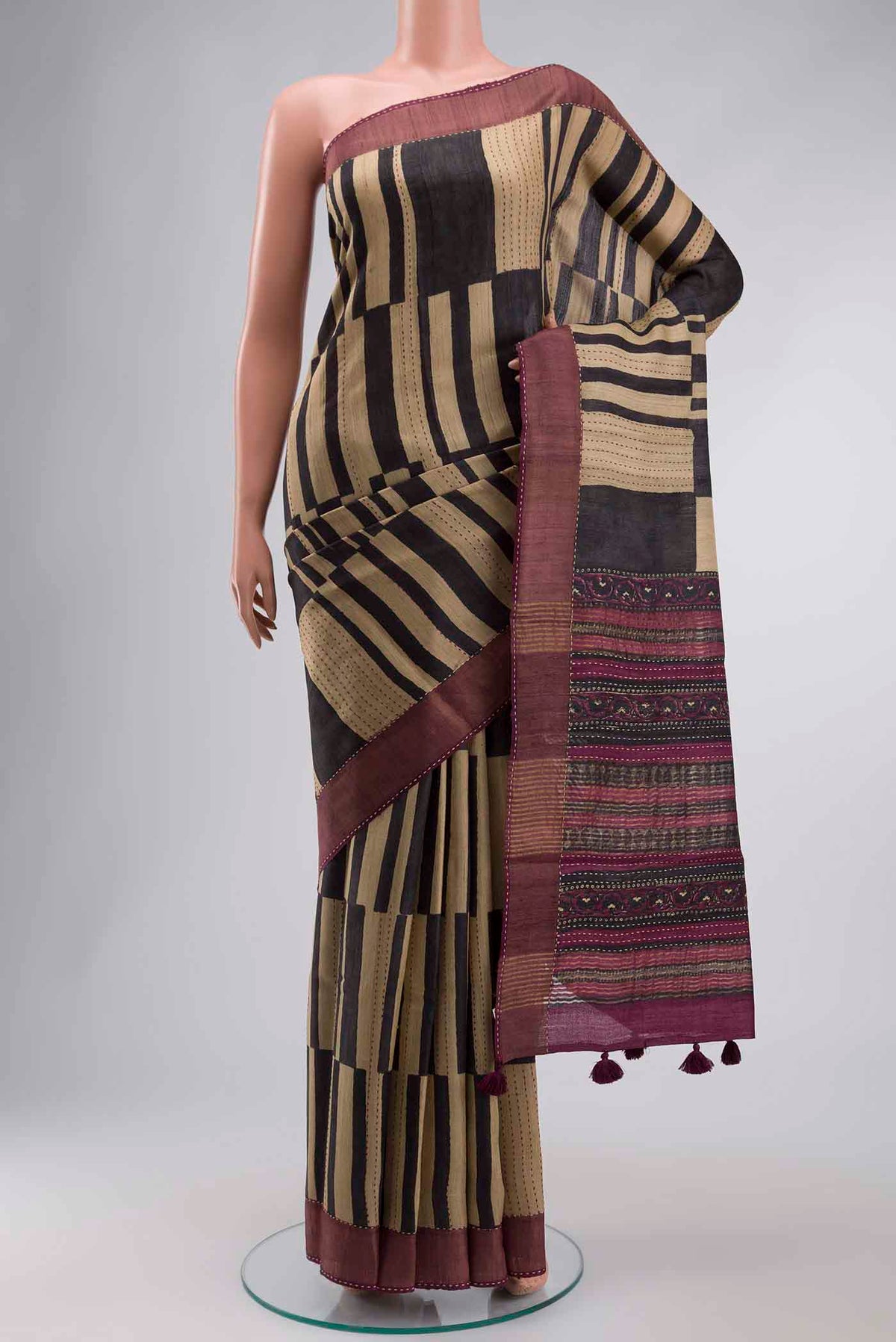 Multi Color Tussar Silk Saree with Stripes on the body and Zari Border displayed on a mannequin