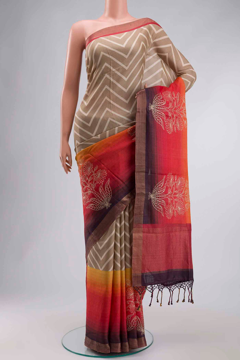 Beige Tussar Silk Saree with Stripes on the body and Zari Border displayed on a mannequin