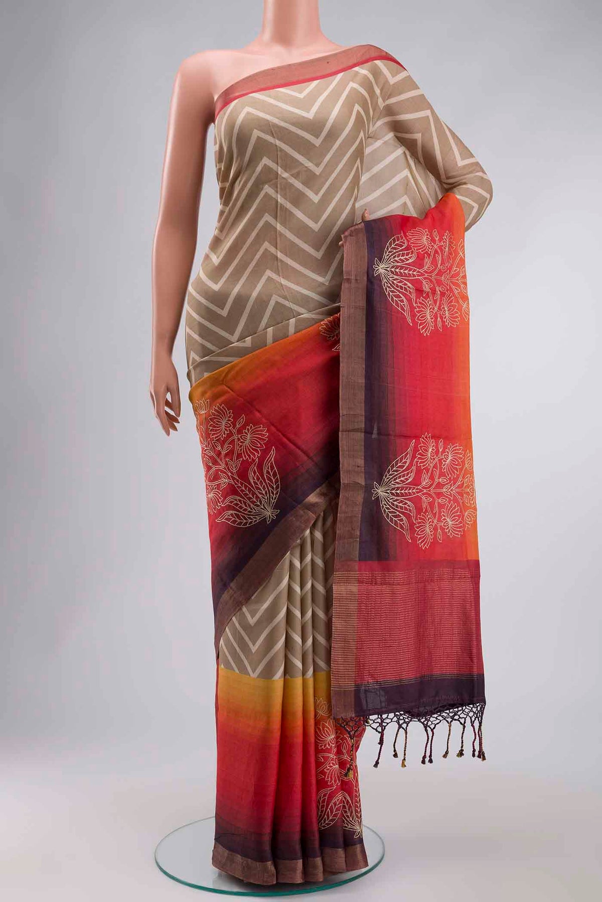 Beige Tussar Silk Saree with Stripes on the body and Zari Border displayed on a mannequin