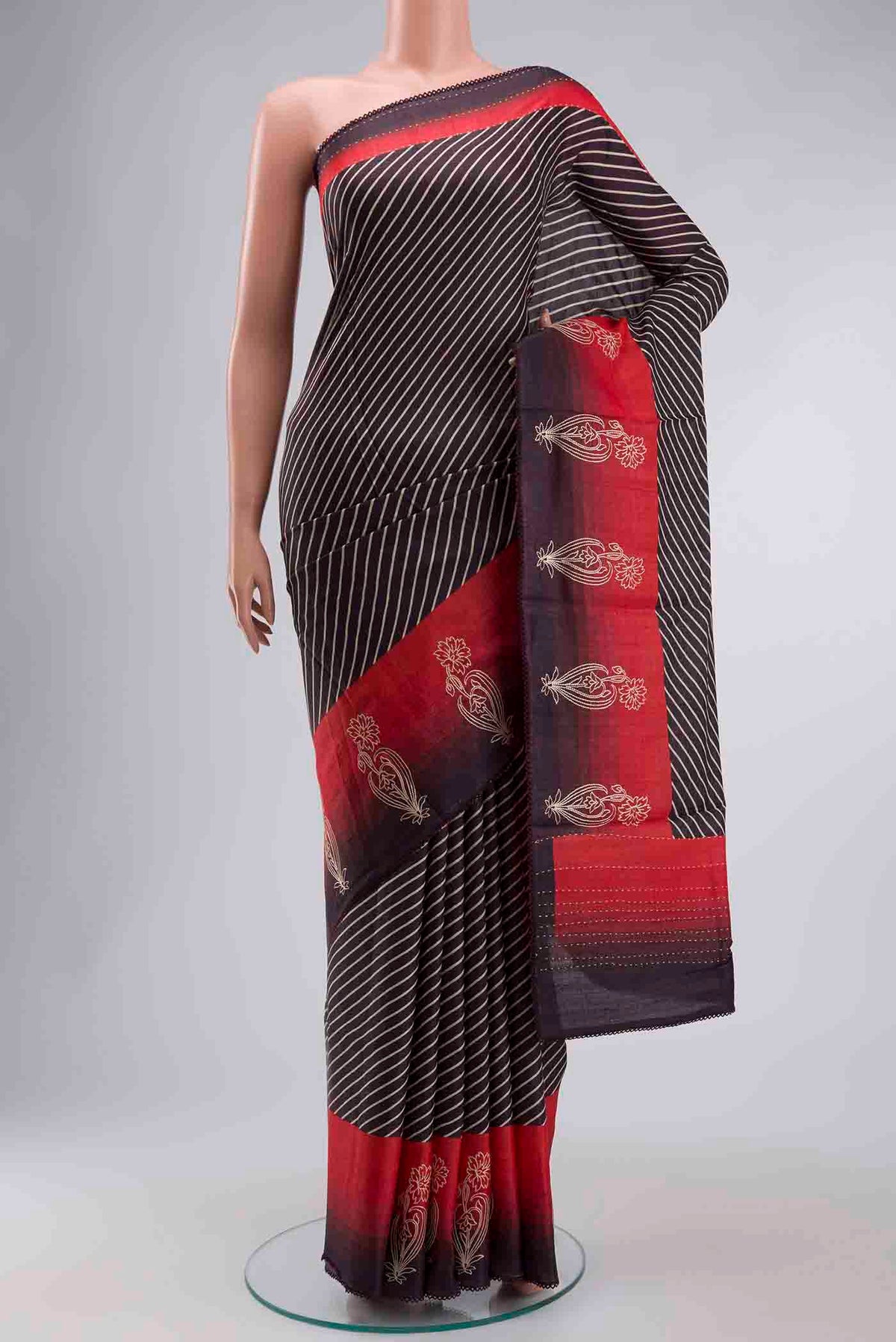 Brown Tussar Silk Saree with Stripes on the body and Embroidery Border displayed on a mannequin