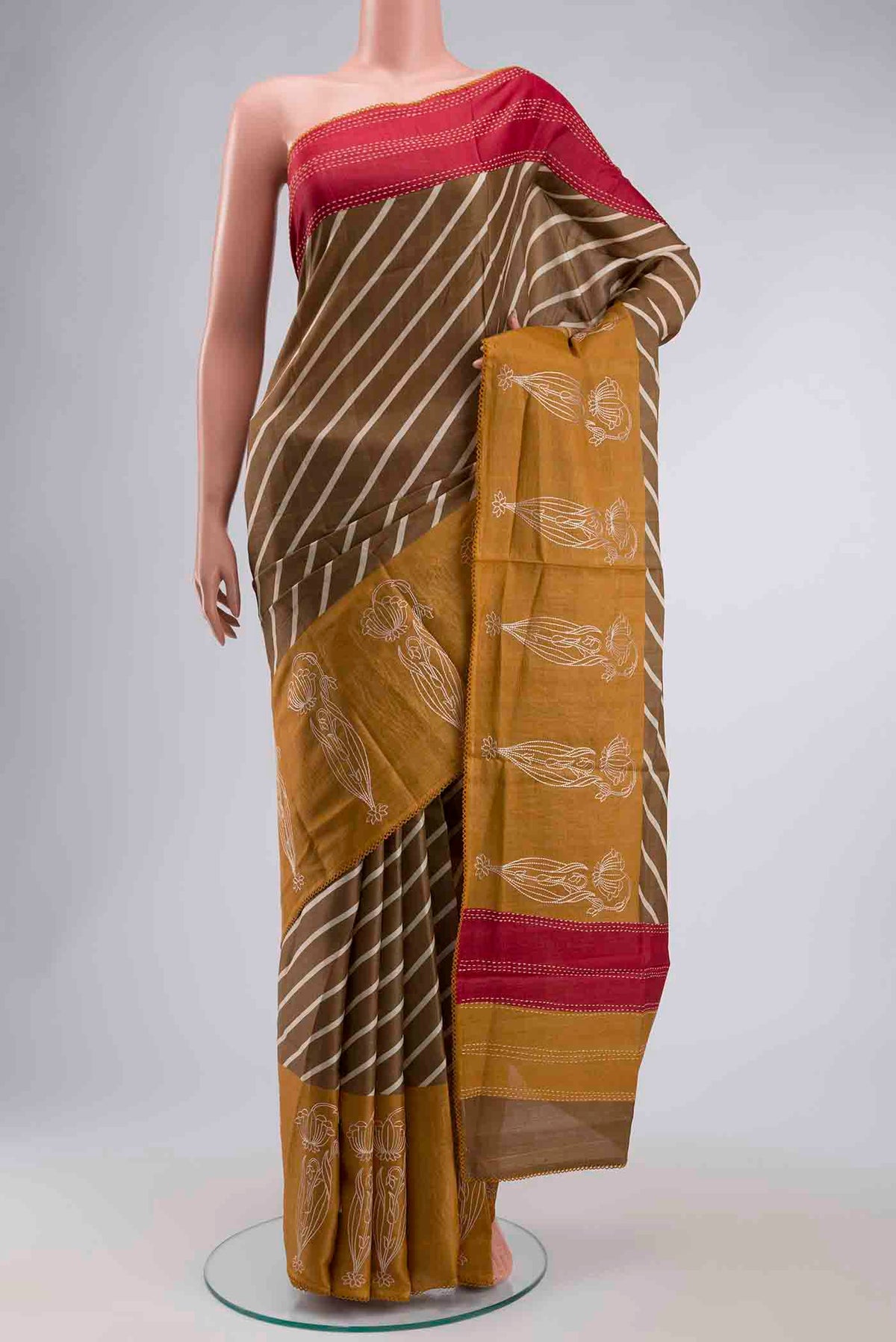 Brown Tussar Silk Saree with Stripes on the body and Embroidery Border displayed on a mannequin