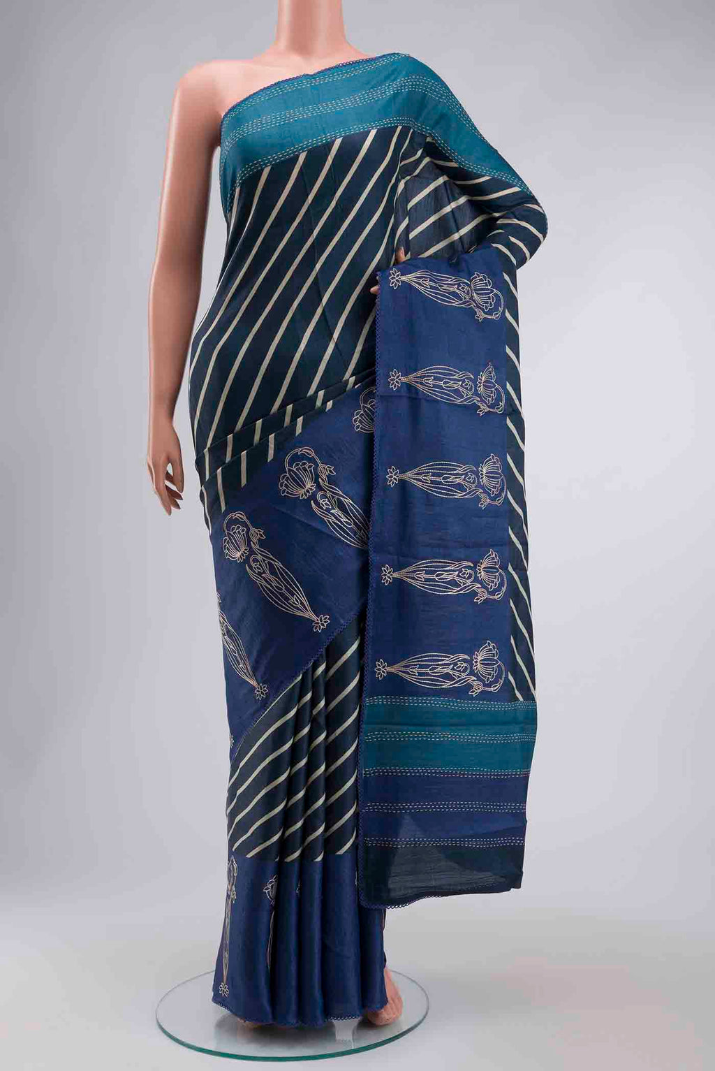 Blue Tussar Silk Saree with Stripes on the body and Embroidery Border displayed on a mannequin