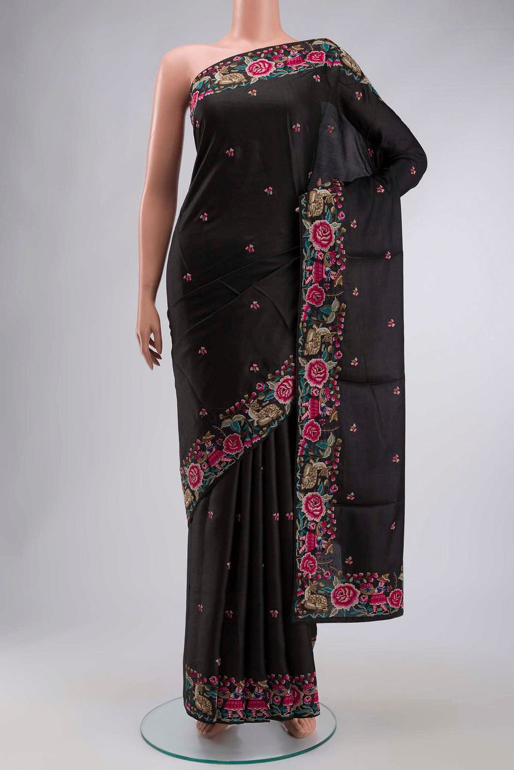 Black Tussar Silk Saree with Embroidery on the body and Embroidery Border displayed on a mannequin