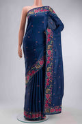 Blue Tussar Silk Saree with Embroidery on the body and Embroidery Border displayed on a mannequin