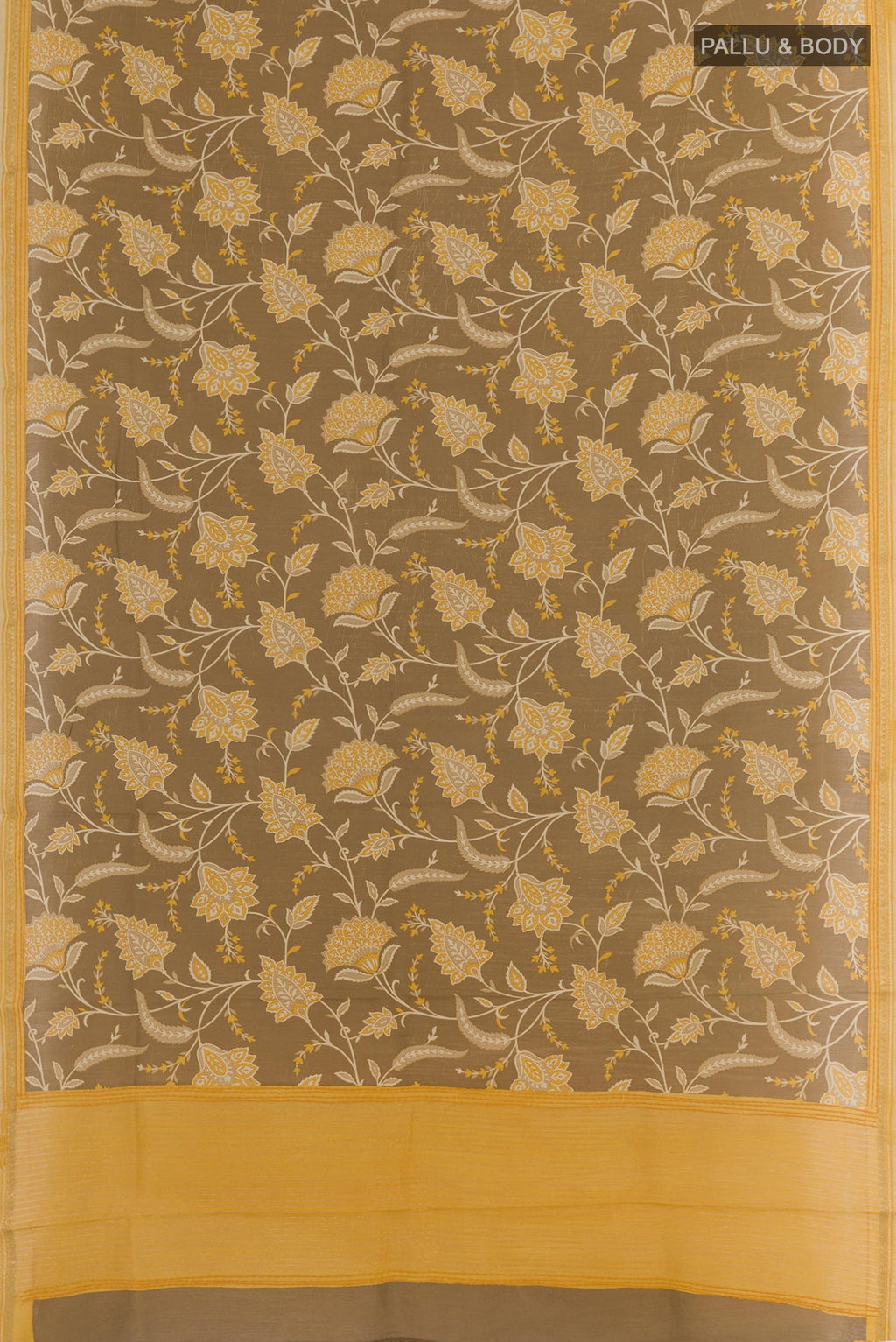 Flat view of Brown Tussar Silk Saree with Printed design on the body and Zari Border. 