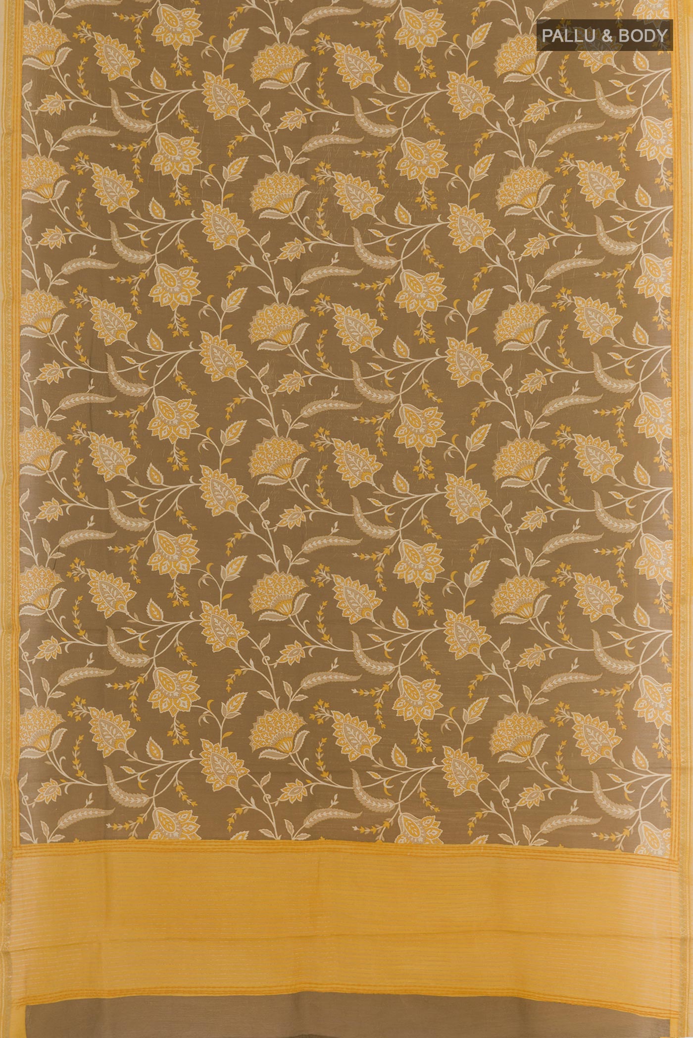 Flat view of Brown Tussar Silk Saree with Printed design on the body and Zari Border. 