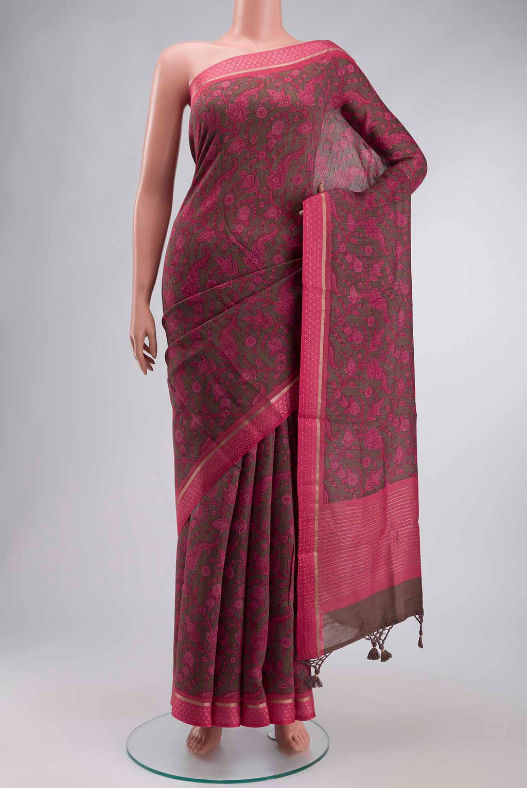 Coral Tussar Silk Saree with Printed design on the body and Thread Border displayed on a mannequin