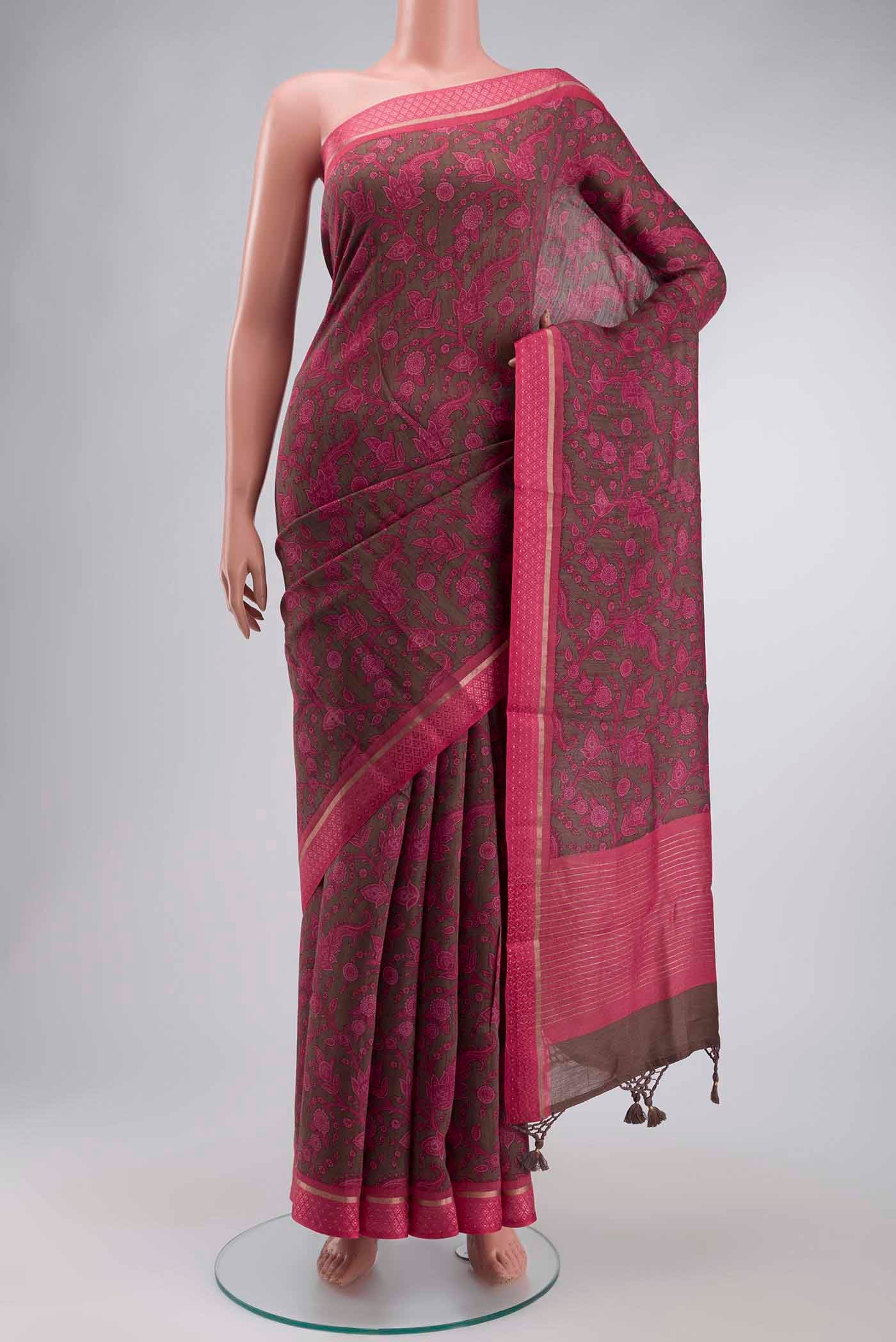 Coral Tussar Silk Saree with Printed design on the body and Thread Border displayed on a mannequin