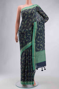 Blue Tussar Silk Saree with Printed design on the body and Zari Border displayed on a mannequin