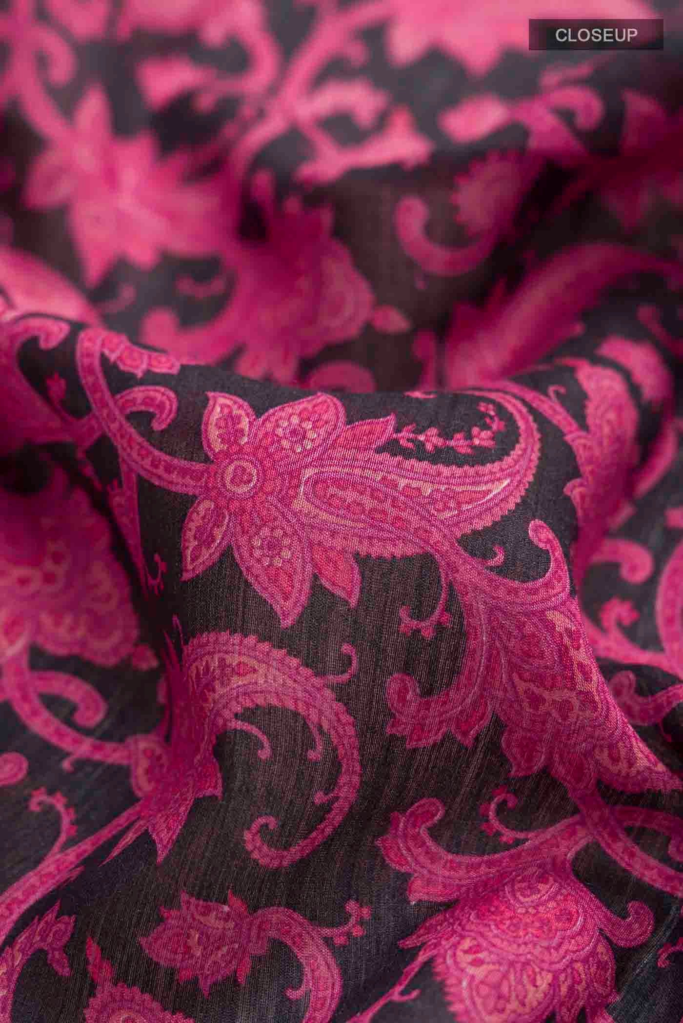 Close up of Black Tussar Silk Saree with Printed design on the body and Zari Border displaying folds