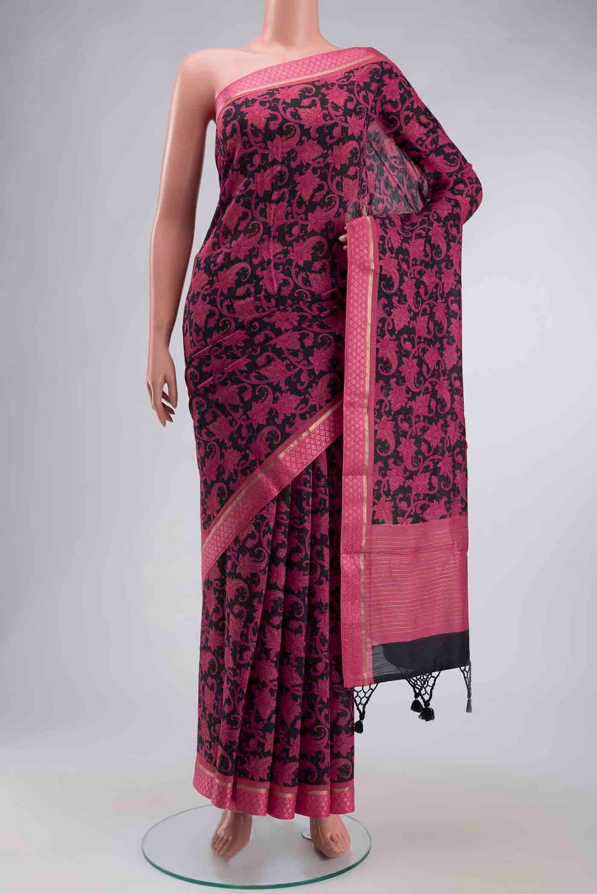 Black Tussar Silk Saree with Printed design on the body and Zari Border displayed on a mannequin