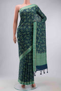 Blue Tussar Silk Saree with Printed design on the body and Zari And Thread Border displayed on a mannequin