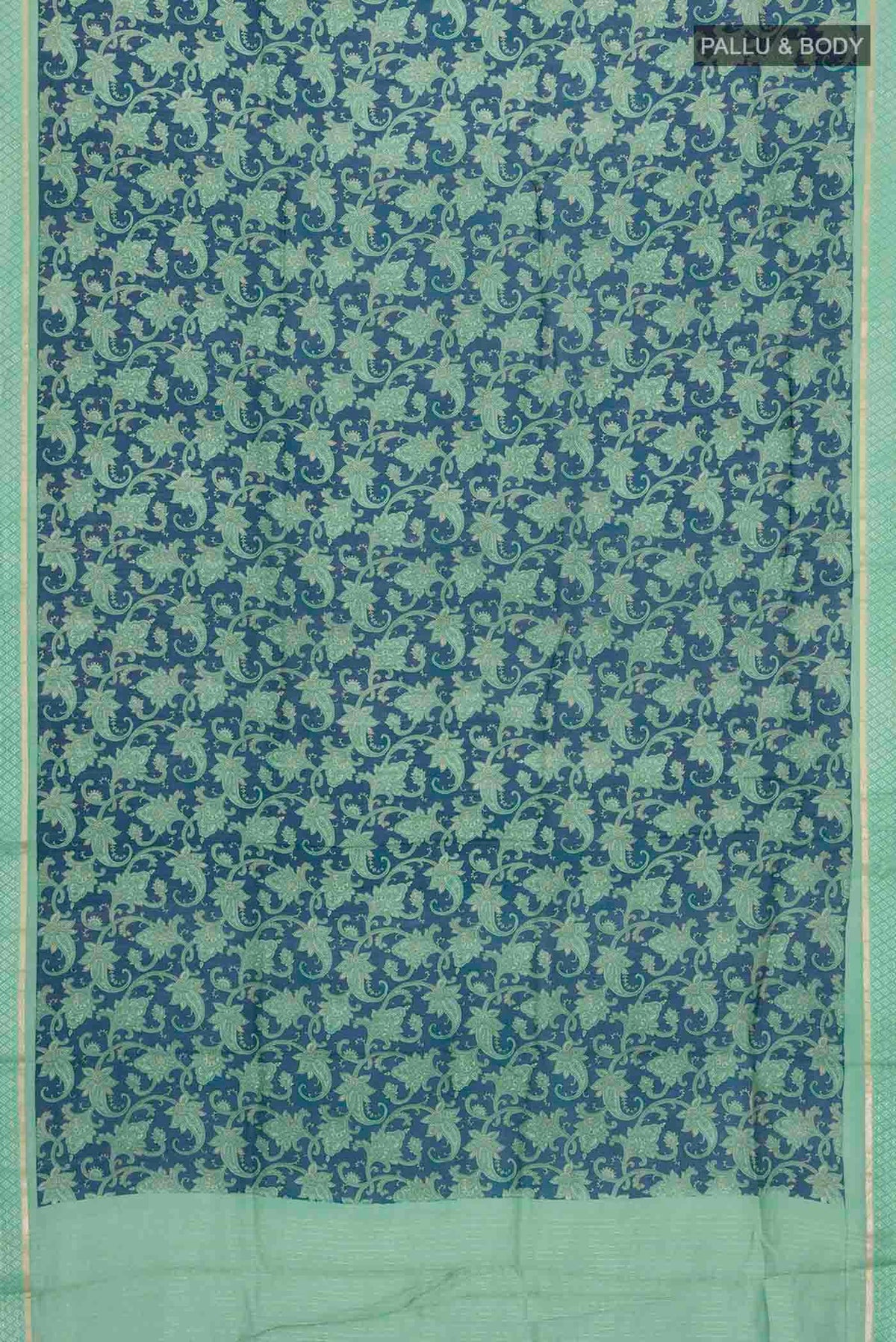 Flat view of Blue Tussar Silk Saree with Printed design on the body and Zari And Thread Border