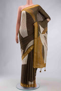Green Tussar Silk Saree with Embroidery on the body and Zari Border displayed on a mannequin