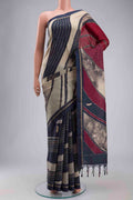 Maroon Tussar Silk Saree with Embroidery on the body and Zari Border displayed on a mannequin