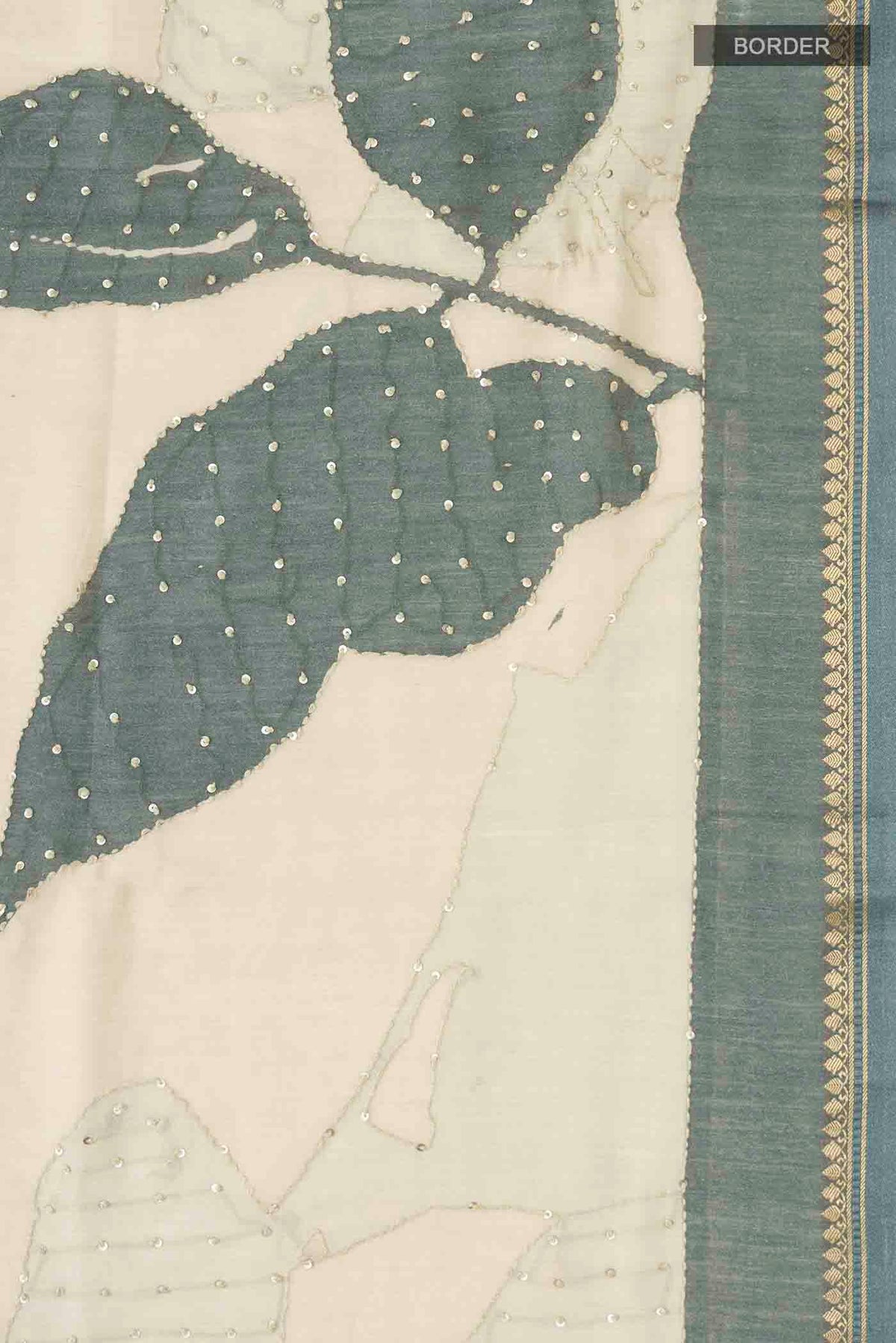 Border image of Cream Tussar Silk Saree with Embroidery on the body and Zari Border