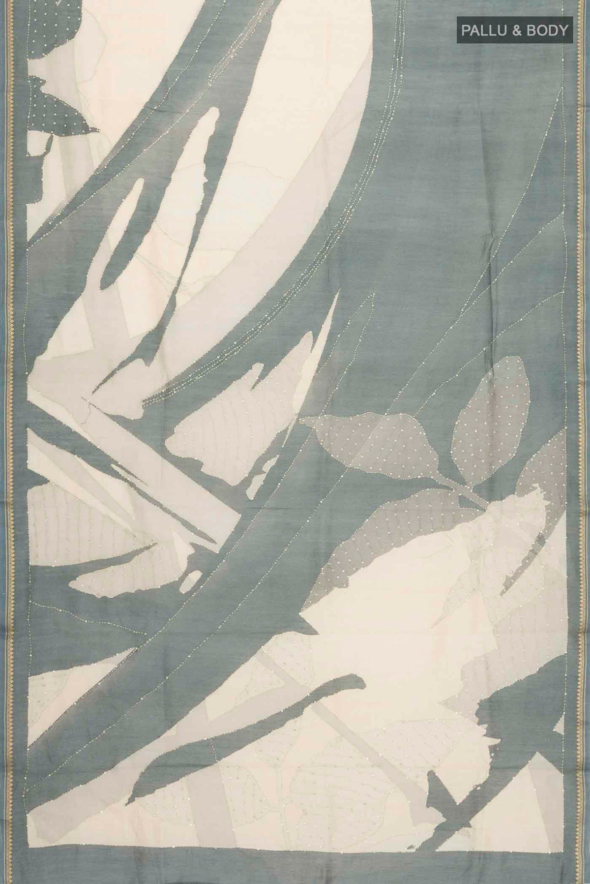 Flat view of Cream Tussar Silk Saree with Embroidery on the body and Zari Border