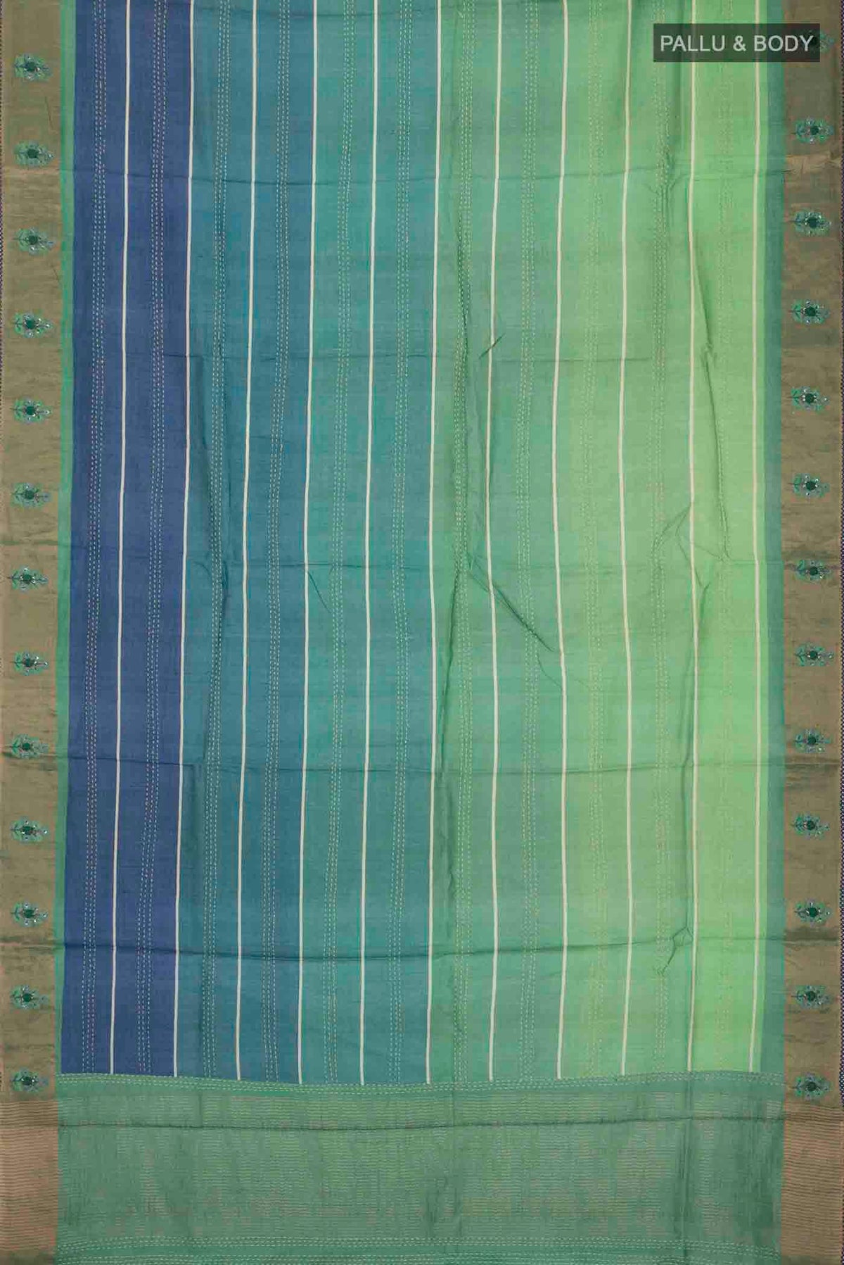 Flat view of Green Tussar Silk Saree with Embroidery on the body and Zari Border