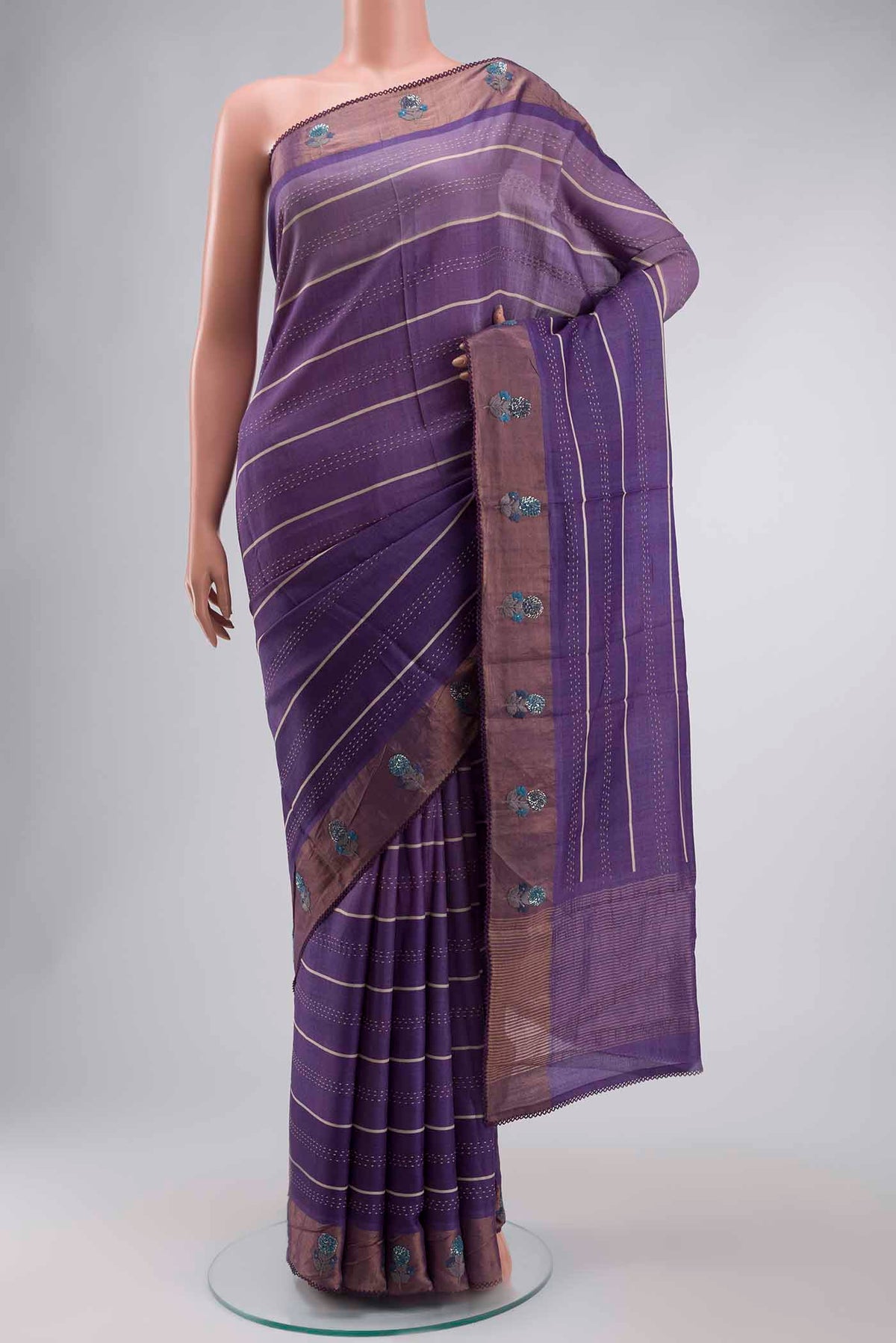 Lavender Tussar Silk Saree with Embroidery on the body and Zari Border displayed on a mannequin