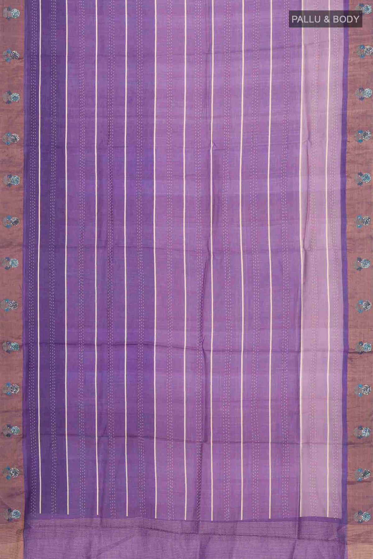 Flat view of Lavender Tussar Silk Saree with Embroidery on the body and Zari Border