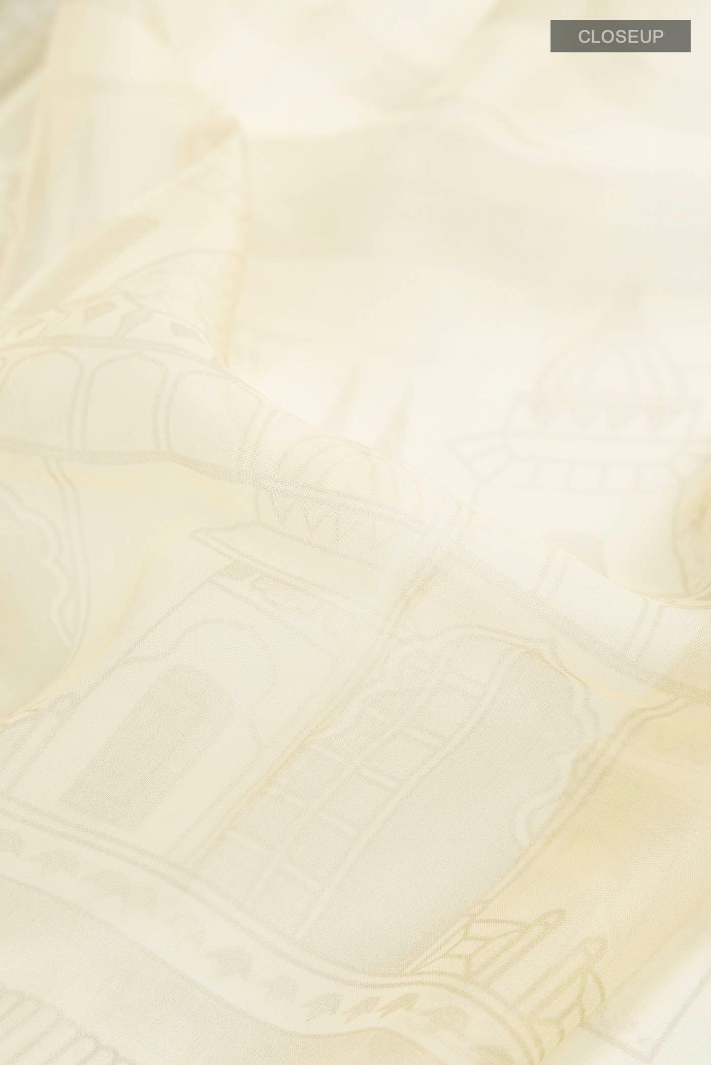 Close up of Yellow Organza Silk Saree with Printed design on the body and Plain Border displaying folds