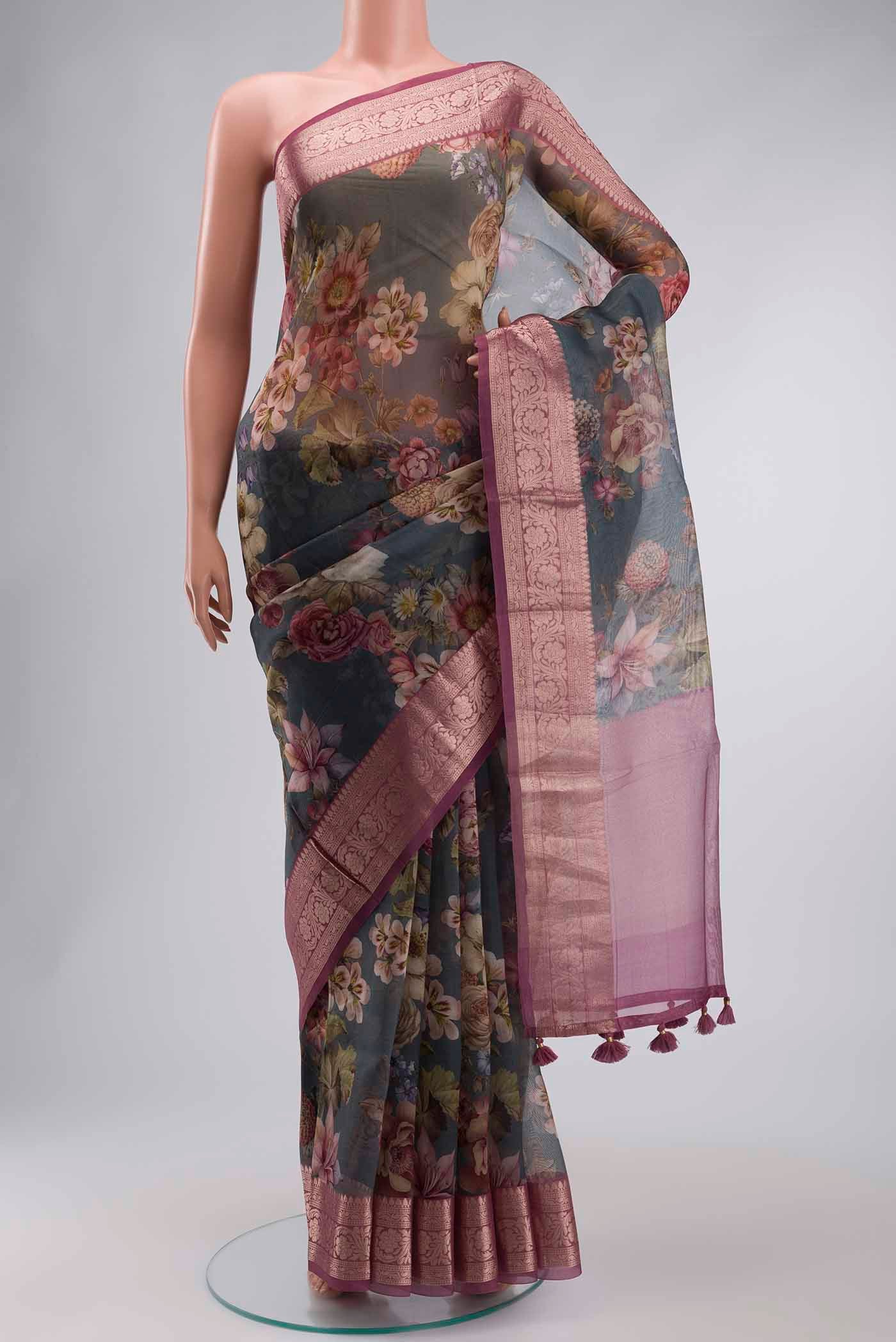 Grey Organza Silk Saree with Printed design on the body and Zari Border displayed on a mannequin
