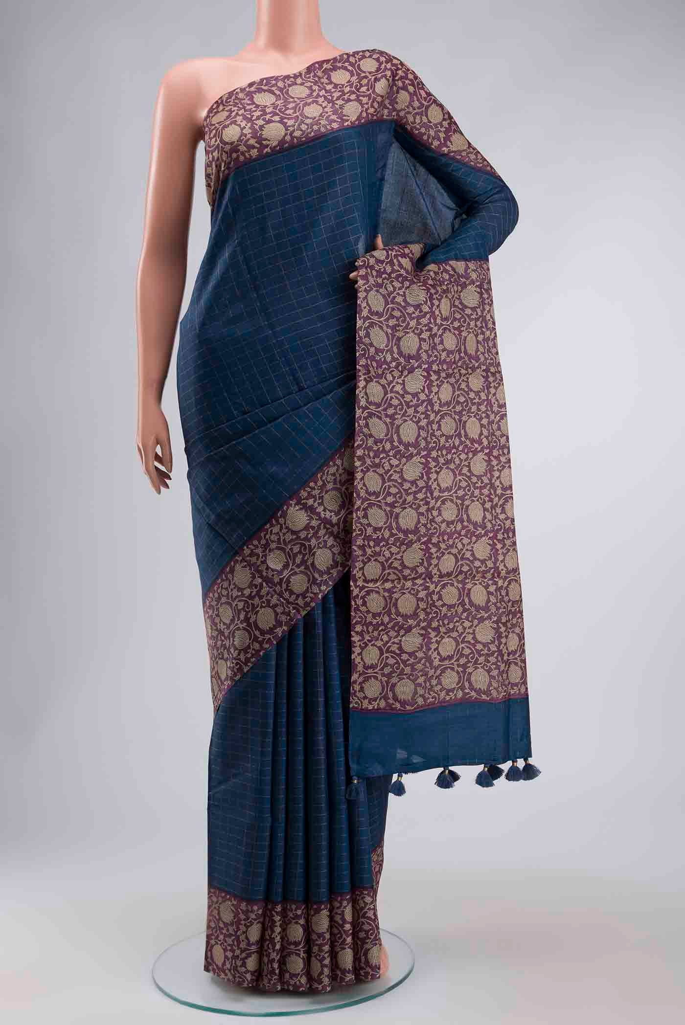Blue Tussar Silk Saree with Checked design on the body and Printed Border displayed on a mannequin