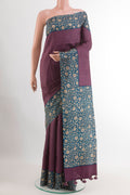 Purple Tussar Saree with Checked design on the body and Printed Border.  displayed on a mannequin