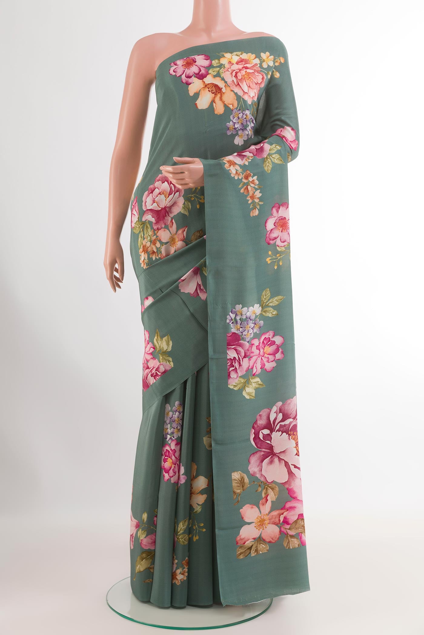 Blue Grey Crepe Saree with Printed design on the body and Printed Border.  displayed on a mannequin