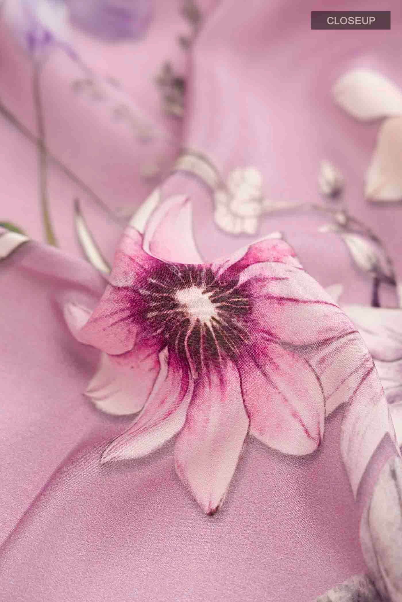 Close up of Lavender Mysore Crepe Saree with Printed design on the body and Plain Border displaying folds