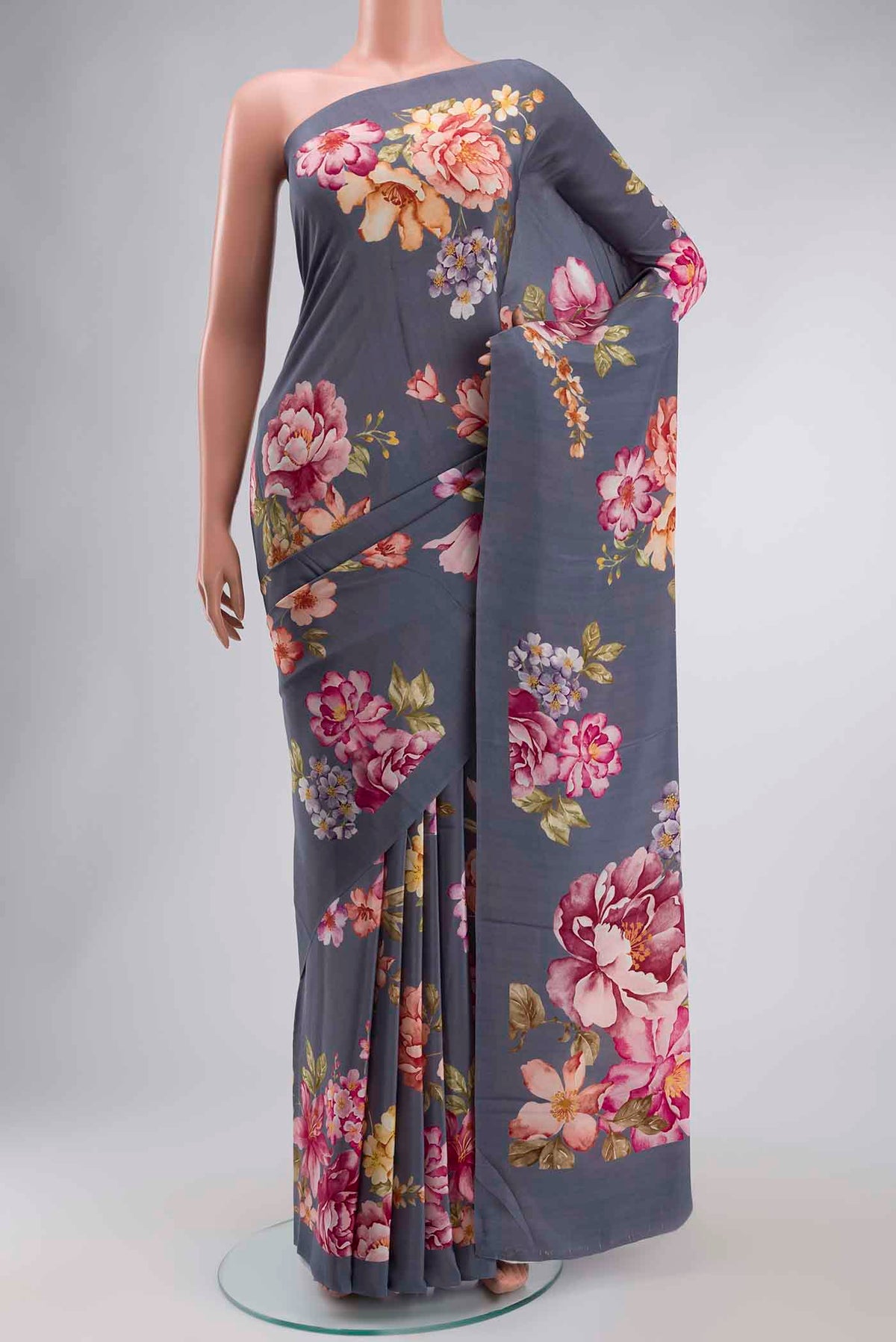 Grey Crepe Saree with Printed design on the body and Plain Border displayed on a mannequin
