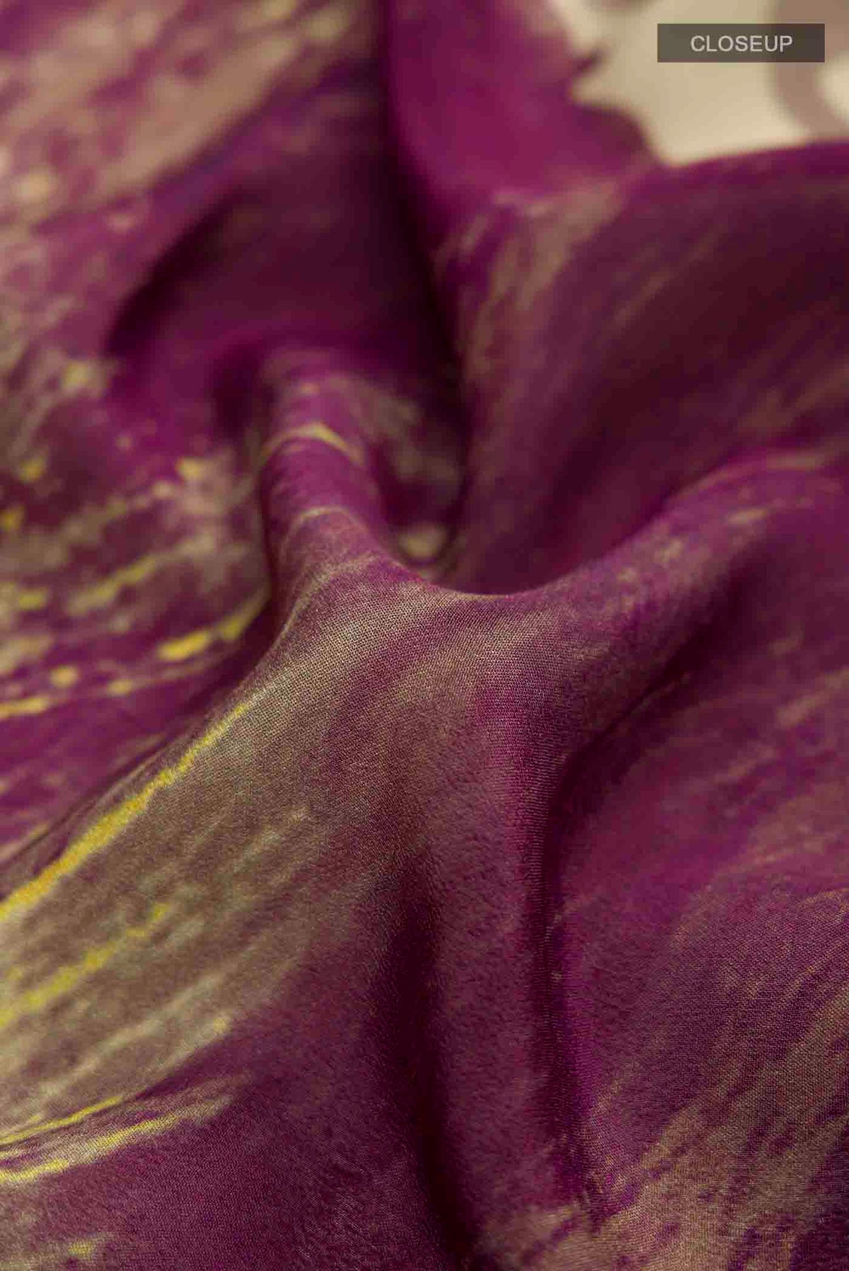 Close up of Multi Color Mysore Crepe Saree with Printed design on the body and Plain Border displaying folds