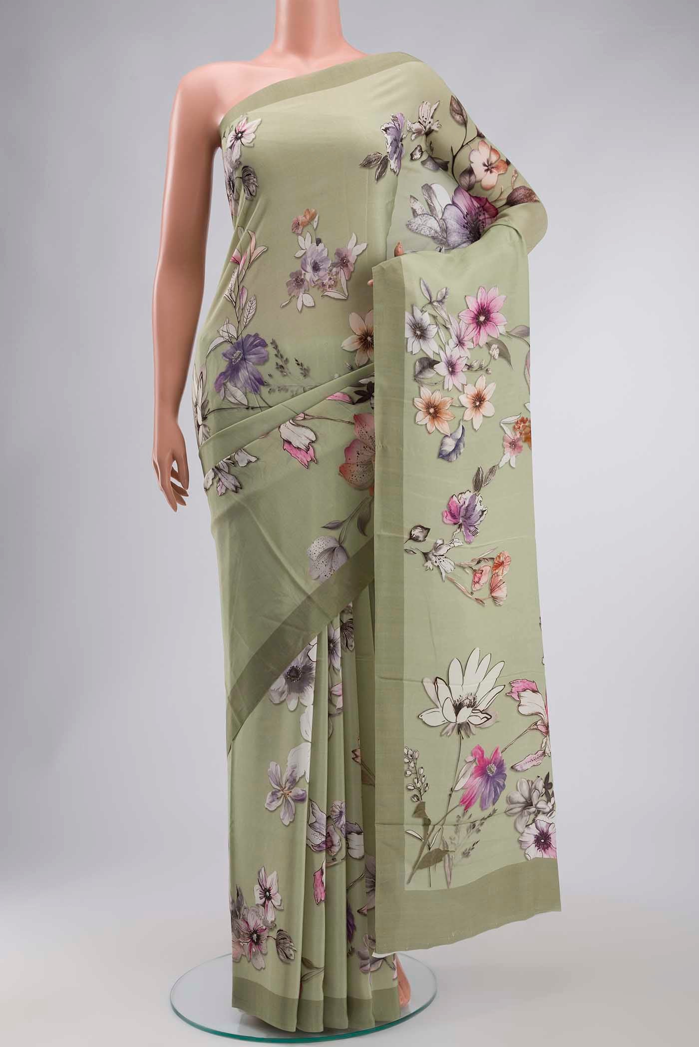 Green Mysore Crepe Saree with Printed design on the body and Plain Border displayed on a mannequin