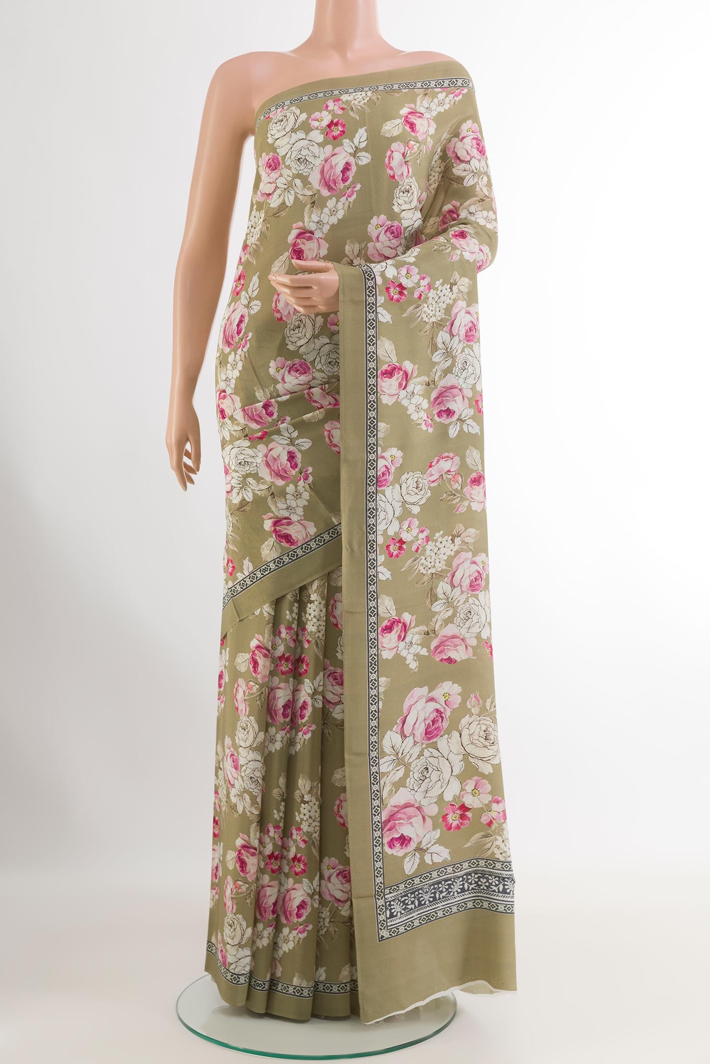 Beige Crepe Saree with Printed design on the body and Printed Border.  displayed on a mannequin
